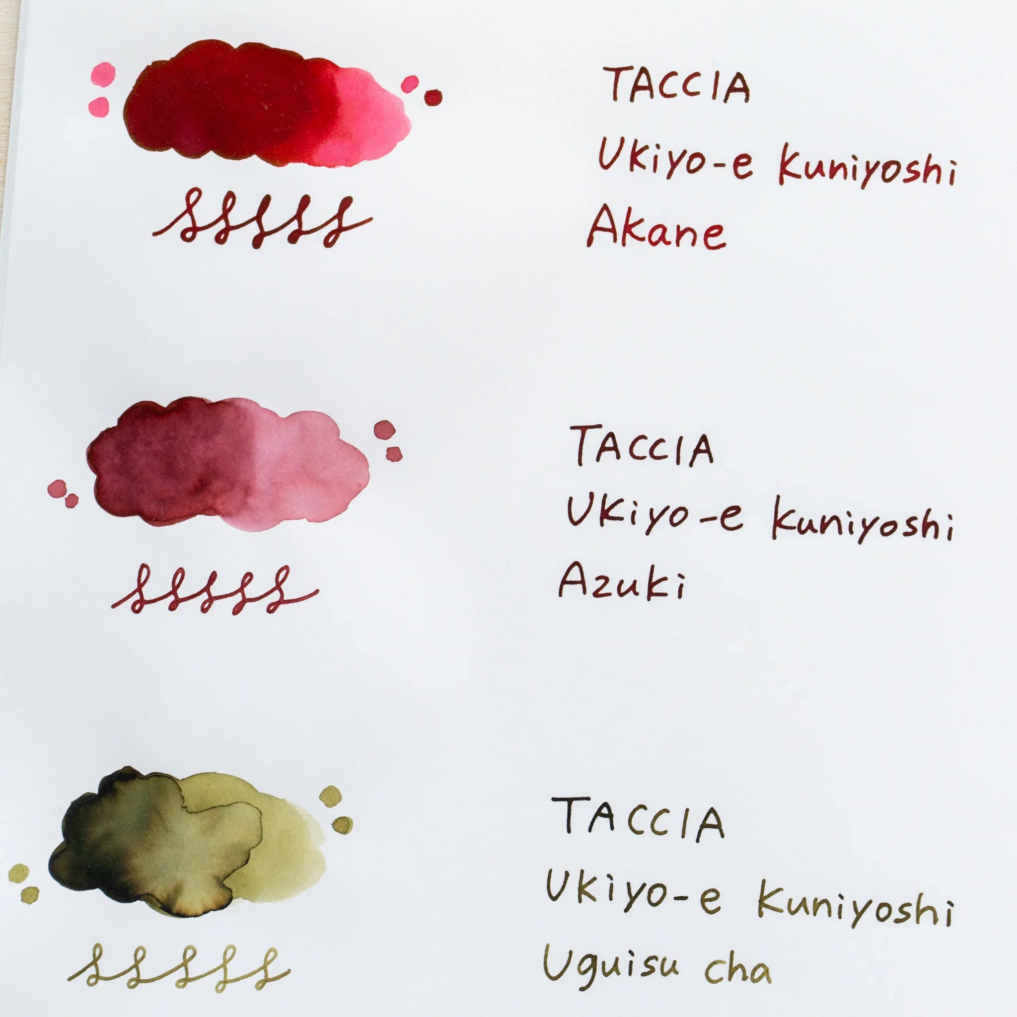 TACCIA Ukiyo-e Kuniyoshi Azuki hand-painted swatch shown with neighboring ink colors on YU-SARI notebook.