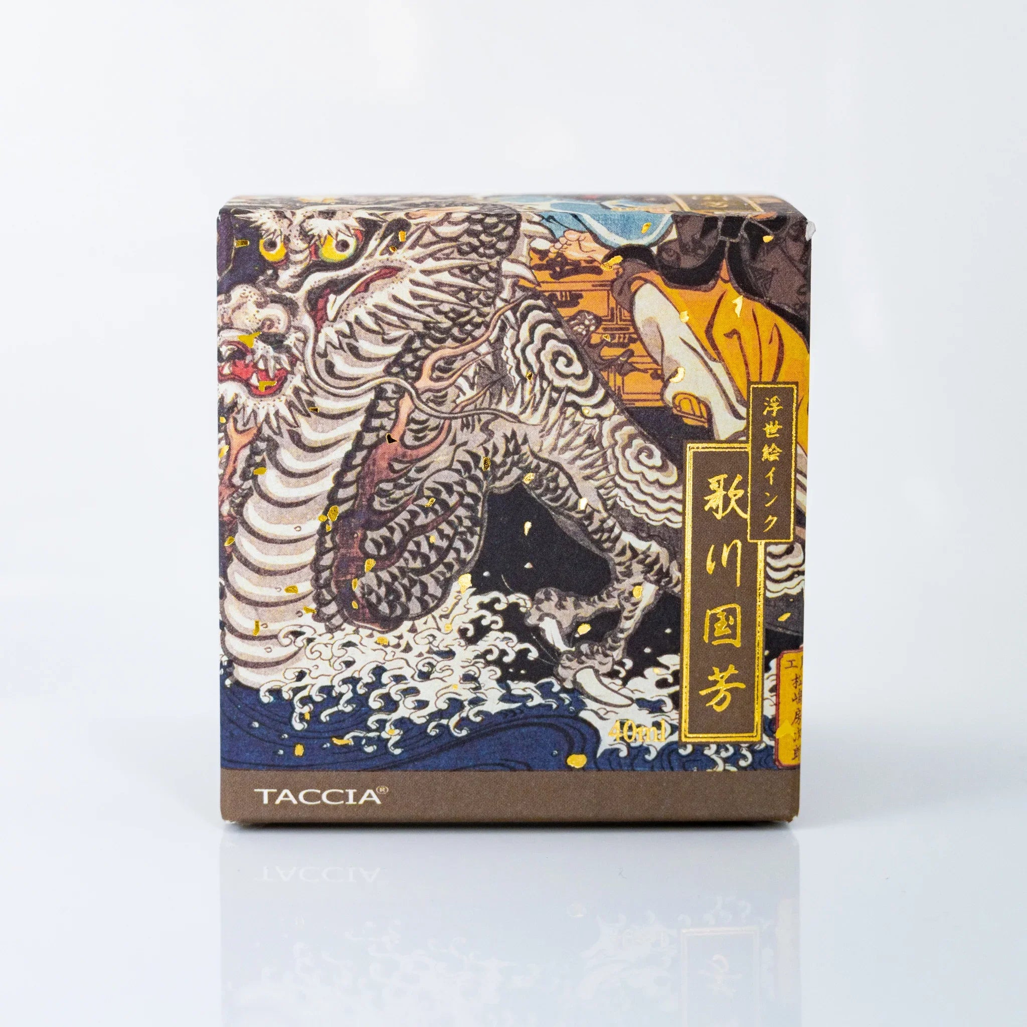 Angled view of TACCIA Kuniyoshi Uguisucha box showing dragon scene from Kuniyoshi's Seven Lucky Gods Treasure Ship.