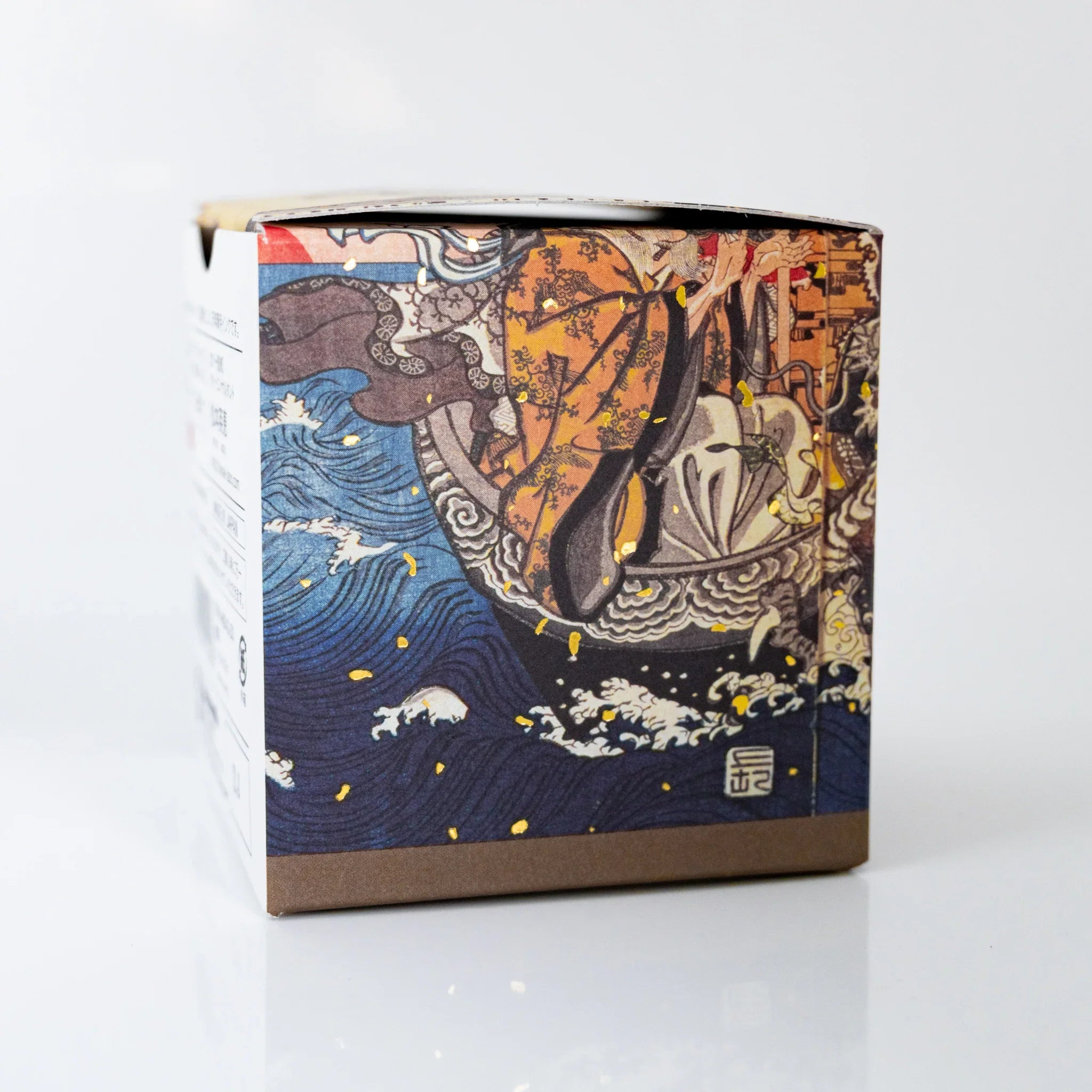 TACCIA Kuniyoshi Uguisucha box panel showing Treasure Ship and waves from Kuniyoshi's Seven Lucky Gods ukiyo-e.
