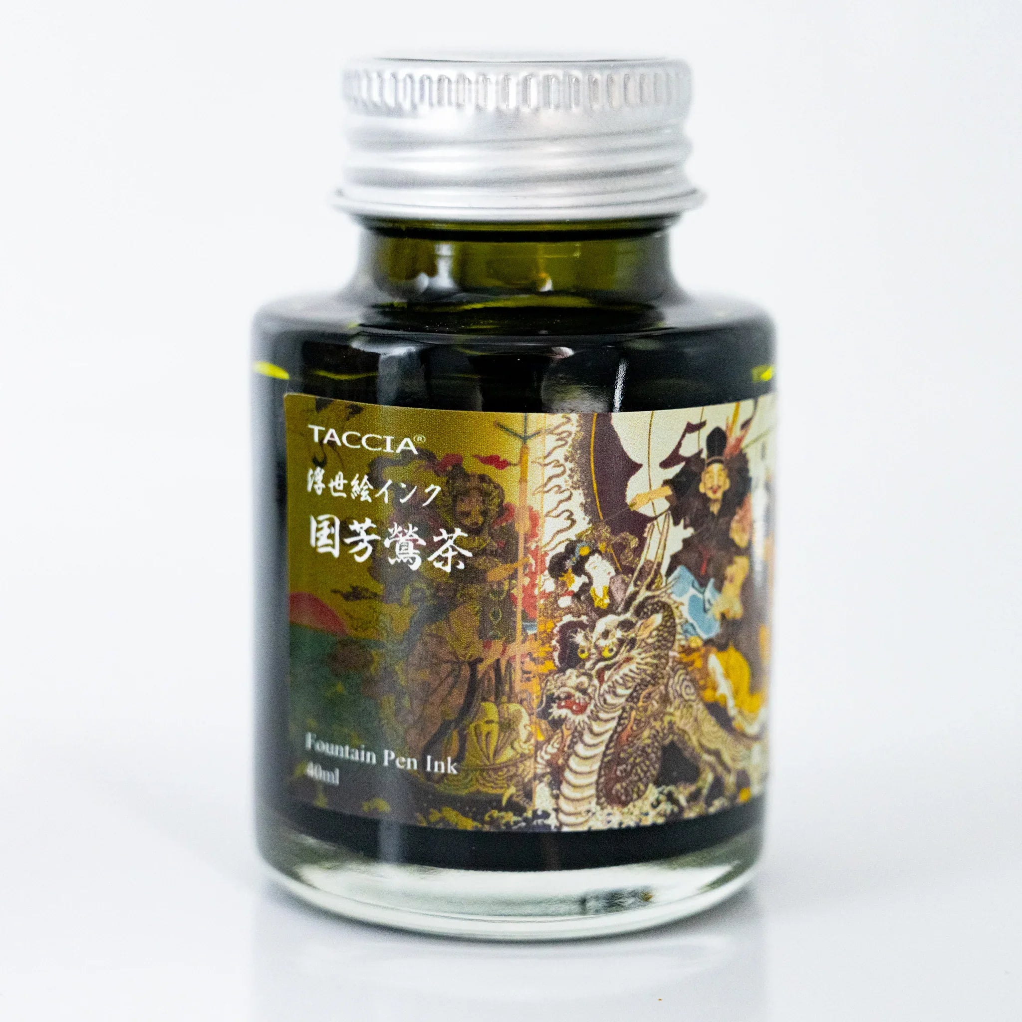 Close-up of TACCIA Kuniyoshi Uguisucha 40ml ink bottle label with dragon and warrior figures by Kuniyoshi.