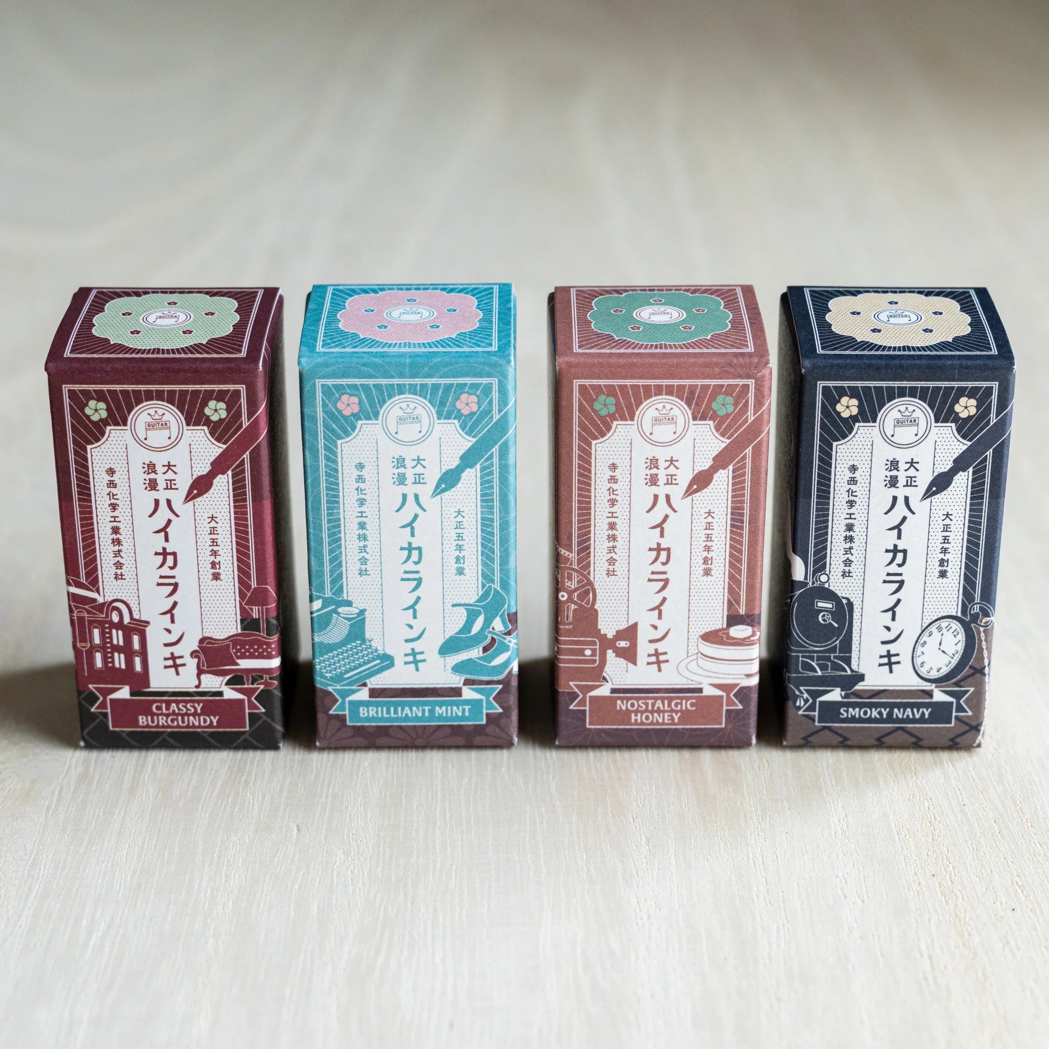Four illustrated Taisho Romance ink boxes in a row for Classy Burgundy, Brilliant Mint, Nostalgic Honey and Smoky Navy