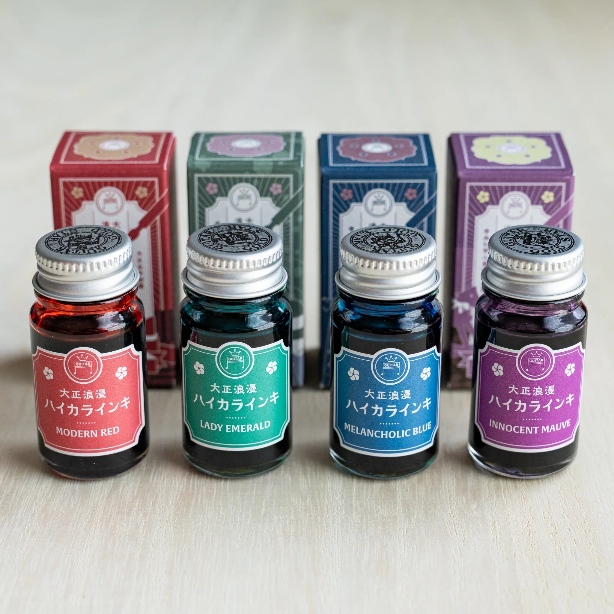 Taisho Romance HAIKARA Sentimental ink set, four 12 ml bottles standing in front of their illustrated boxes