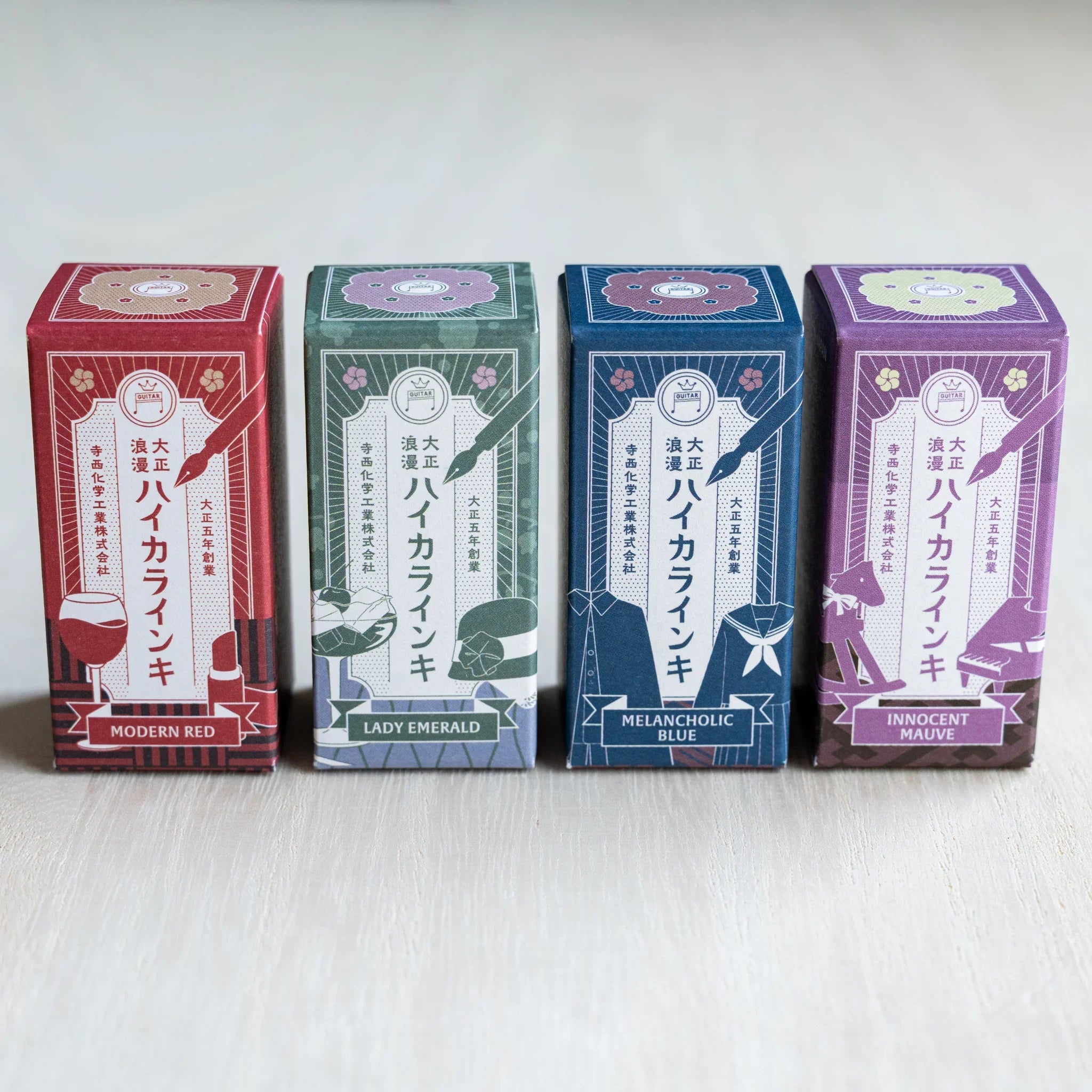 Four illustrated Taisho Romance ink boxes in a row for Modern Red, Lady Emerald, Melancholic Blue and Innocent Mauve