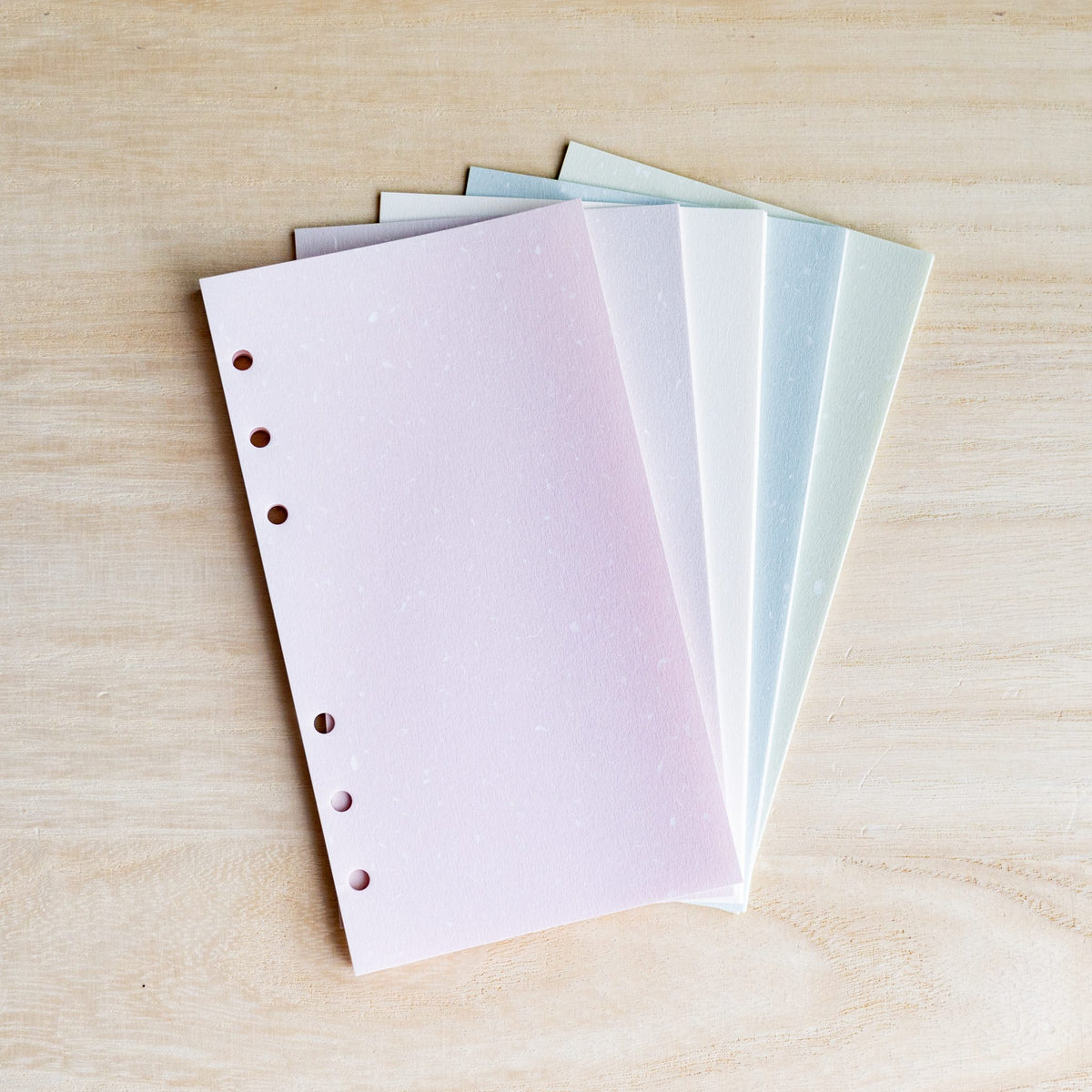 Five Feather Waltz Bible refill sheets fanned in pale pink, lavender, white, light blue and pale green, 6 holes