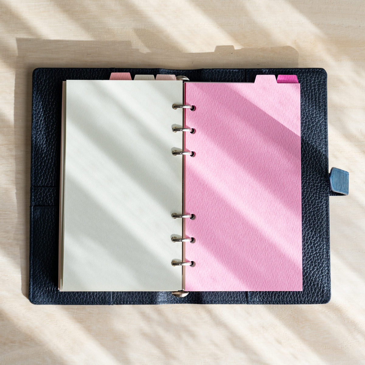 Open Ise Gikakushi Bible planner with a cream page and a bright pink Mermaid index divider on silver rings