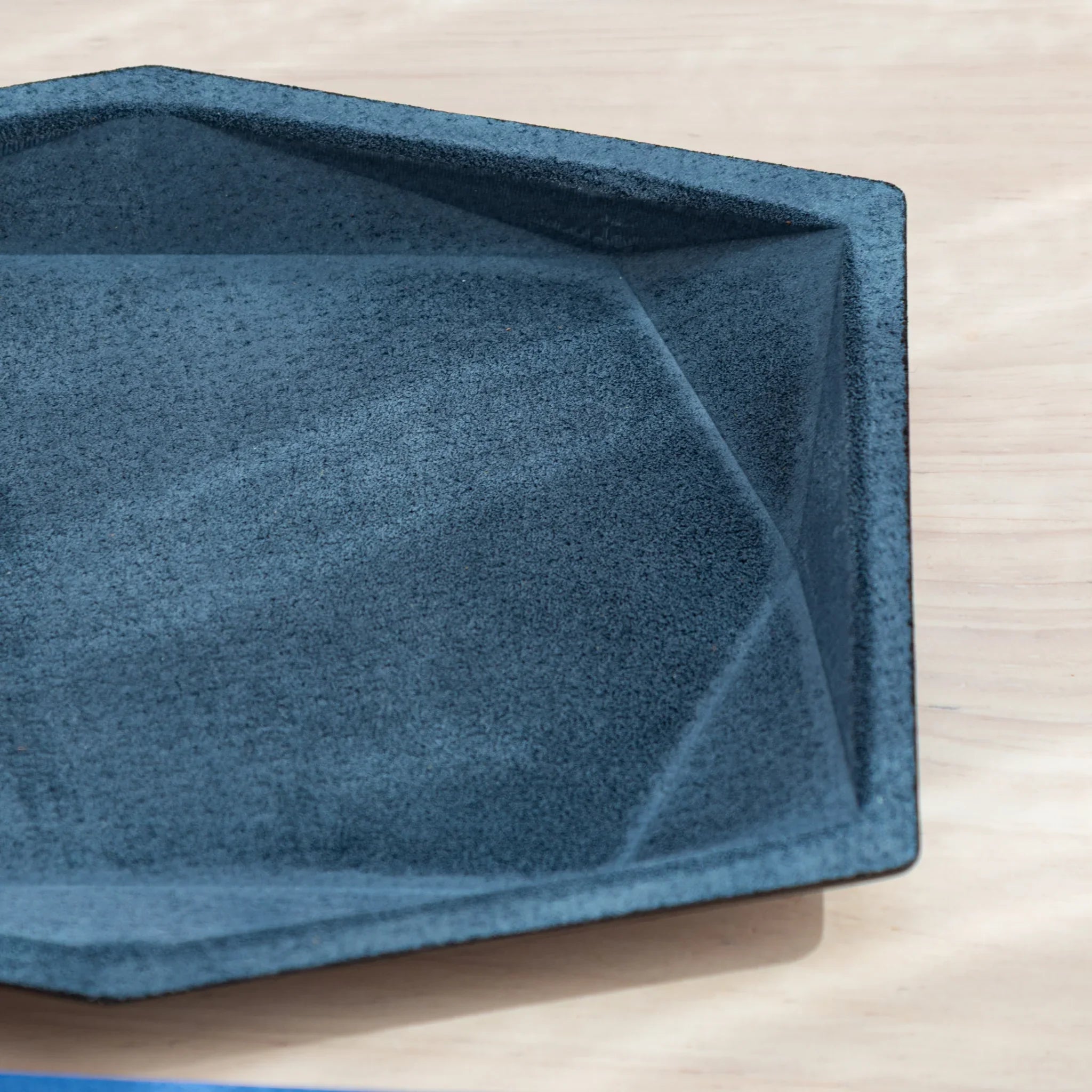 Close-up of the corner of the Japanese Pen Tray showing the suede texture.