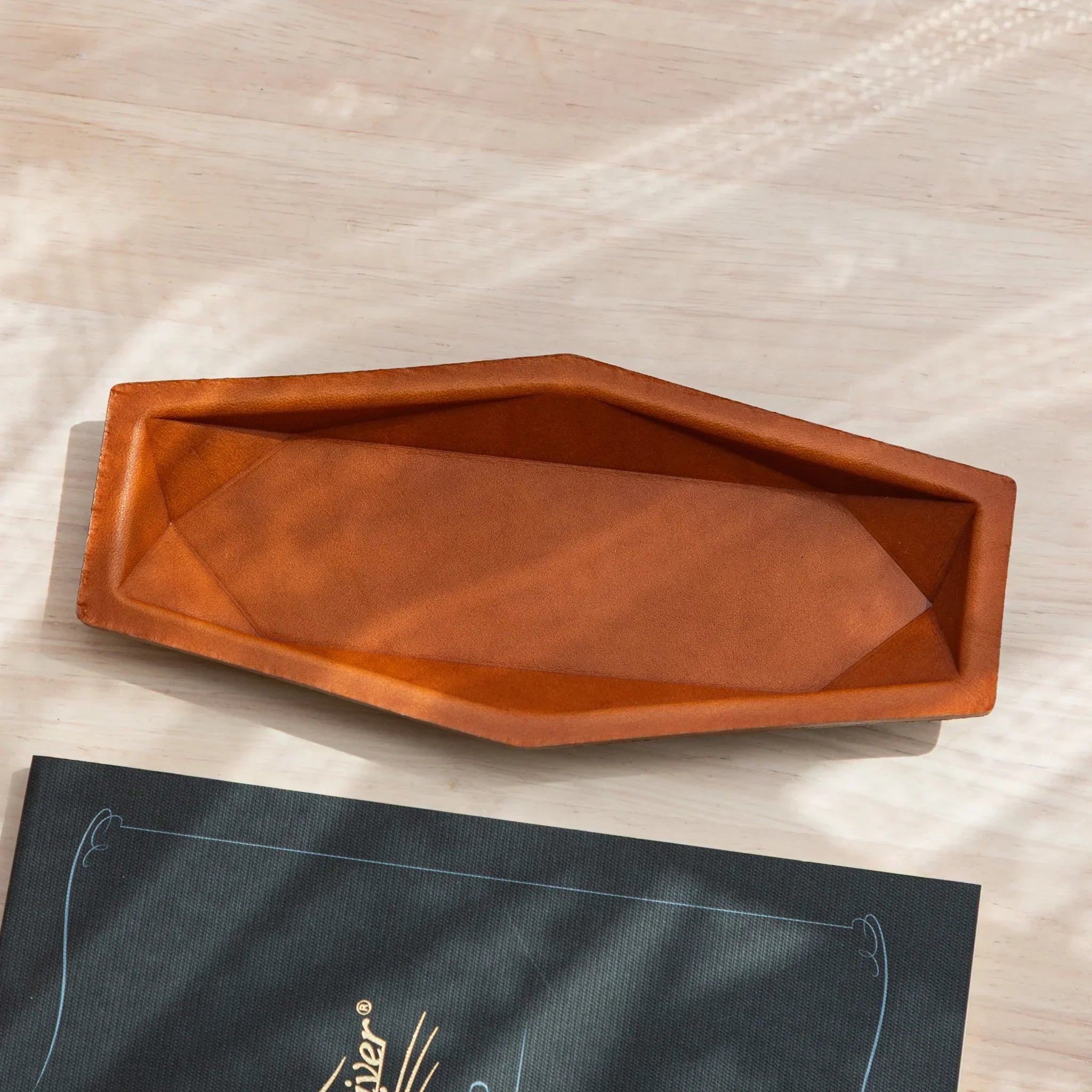 Camel Japanese Pen Tray in leather, shown empty with angular interior design.