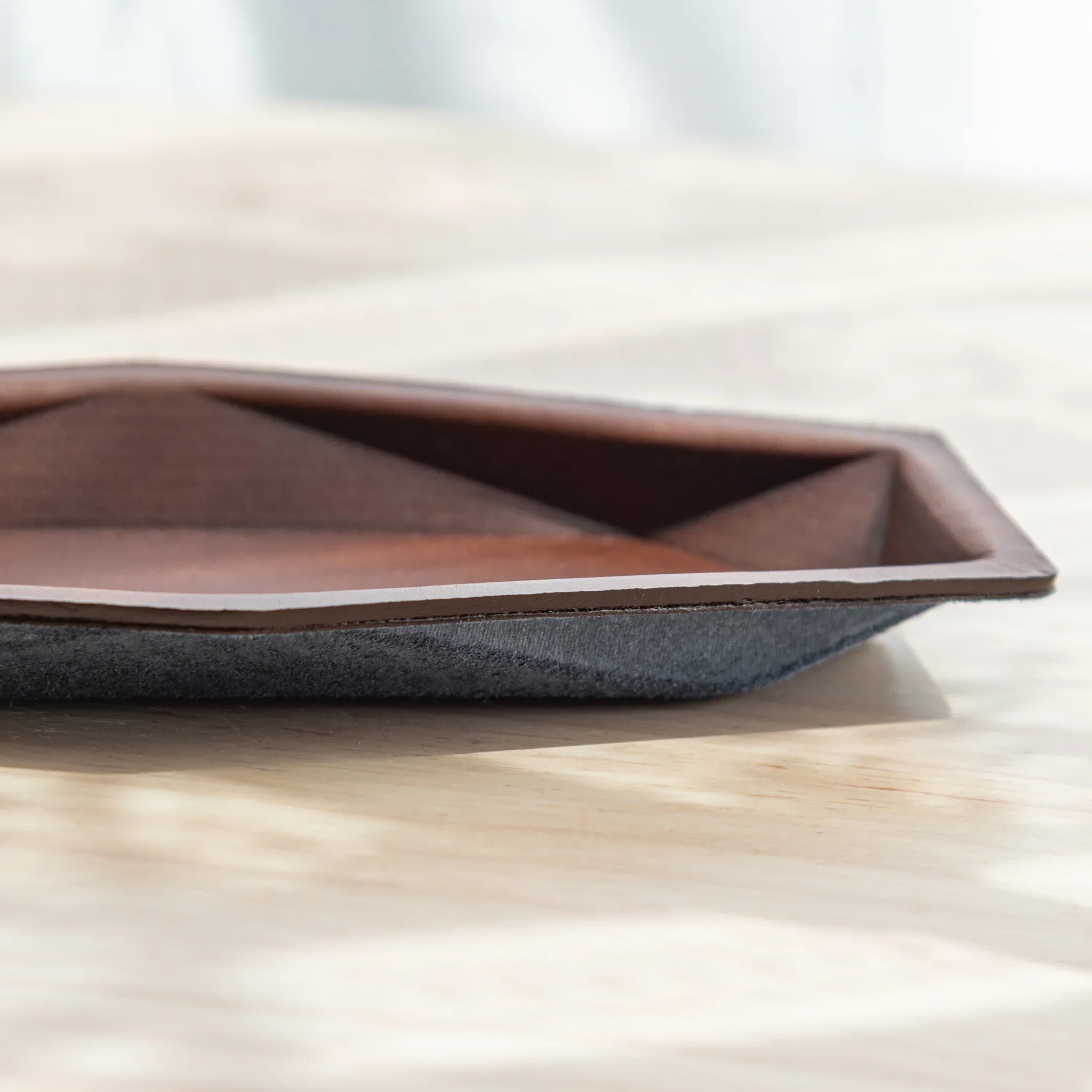 Side profile of the dark brown Japanese Pen Tray showing its slim hexagonal shape.