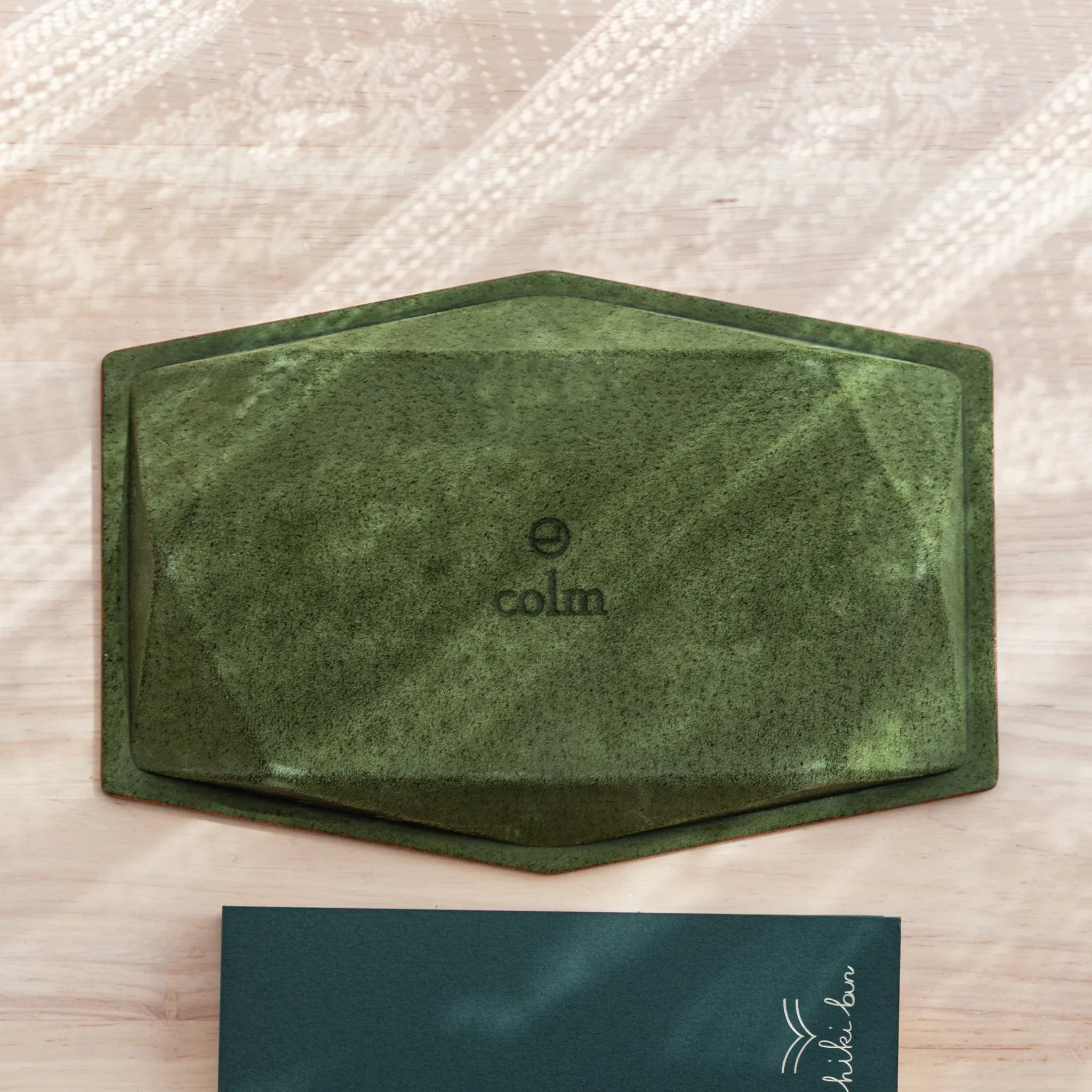 Suede back of Tatsuno Leather Pen Tray Slim with colm logo and rubber pads.