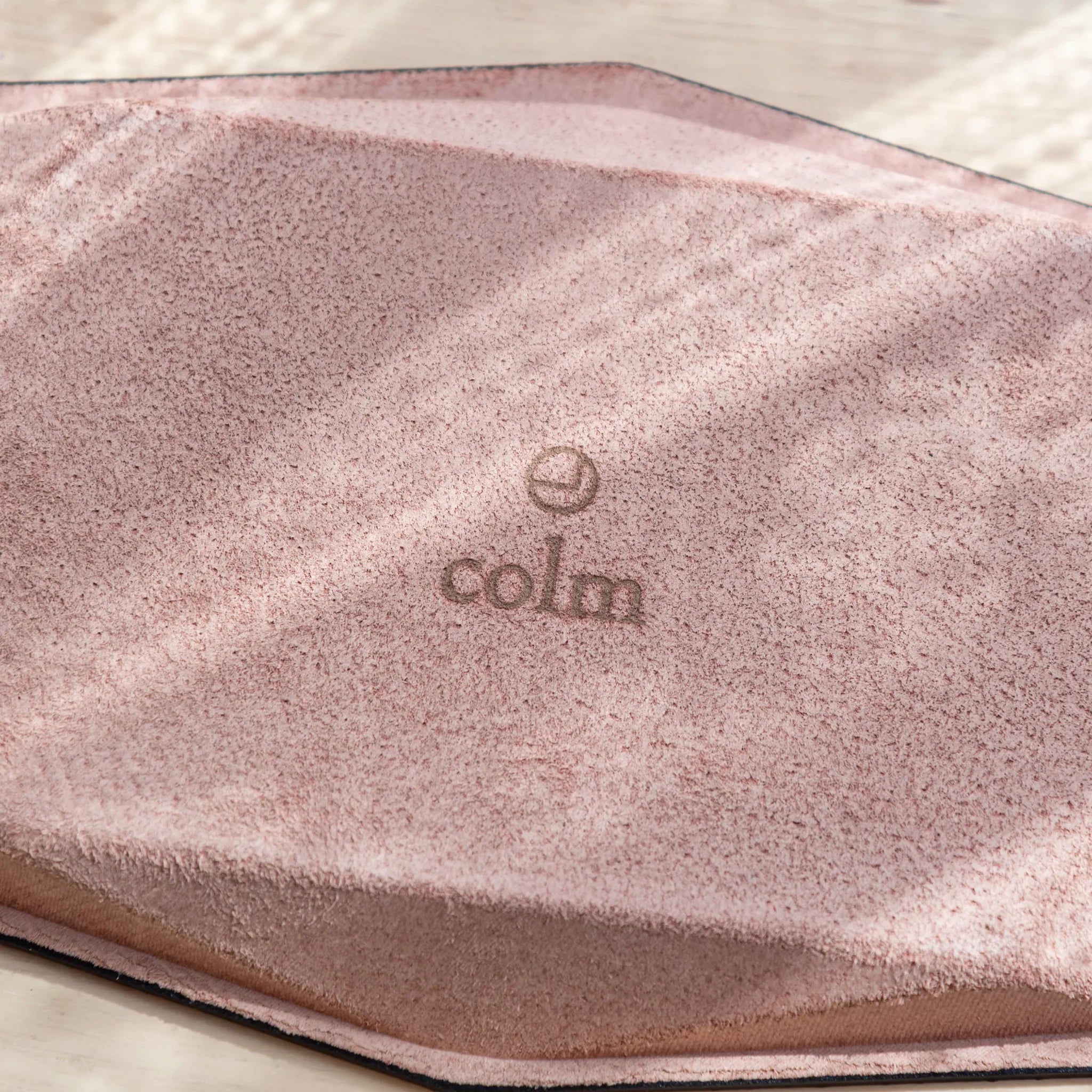 Close-up of the “colm” logo on the suede underside of the Japanese Pen Tray.