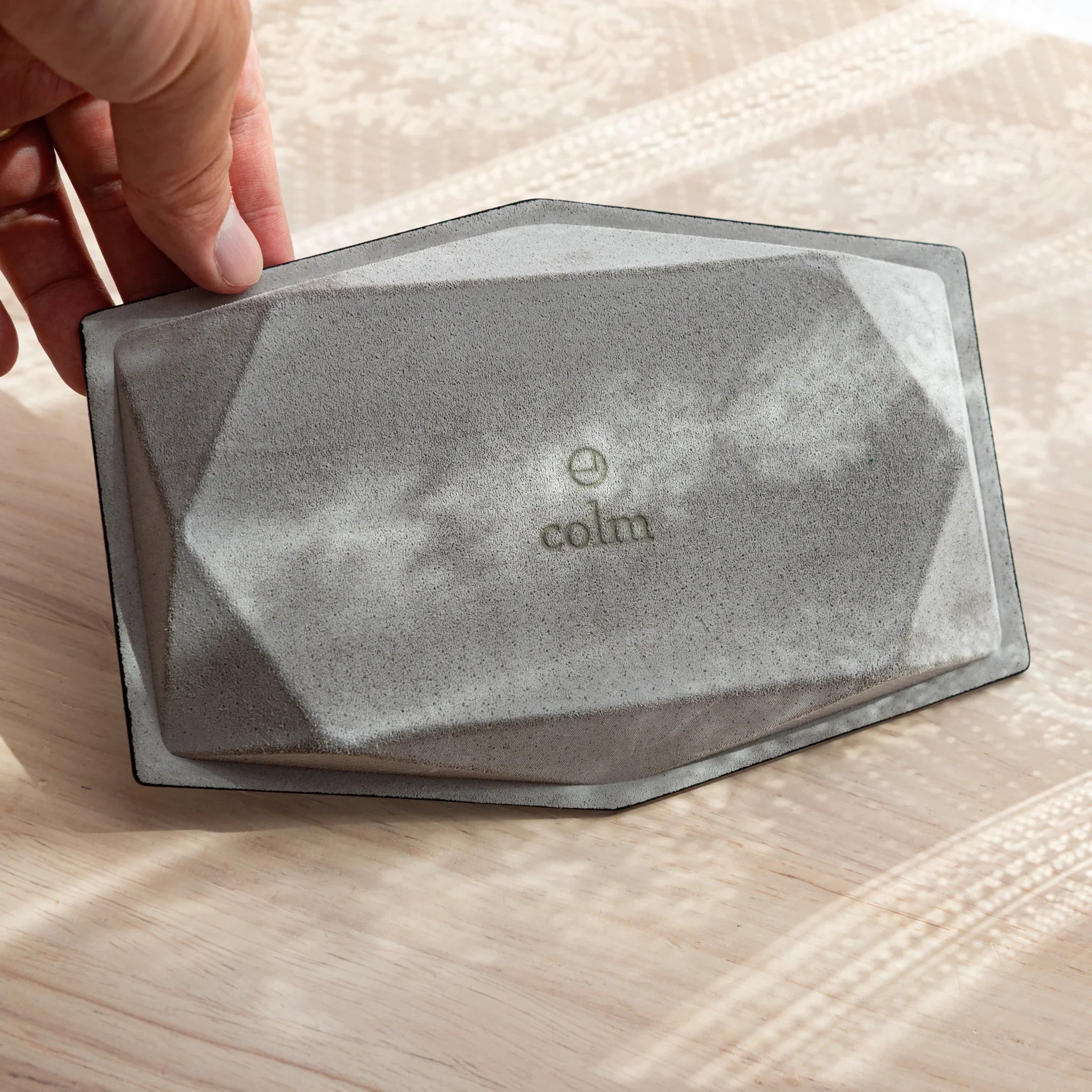 Bottom side of leather Japanese Pen Tray showing colm logo and suede texture.