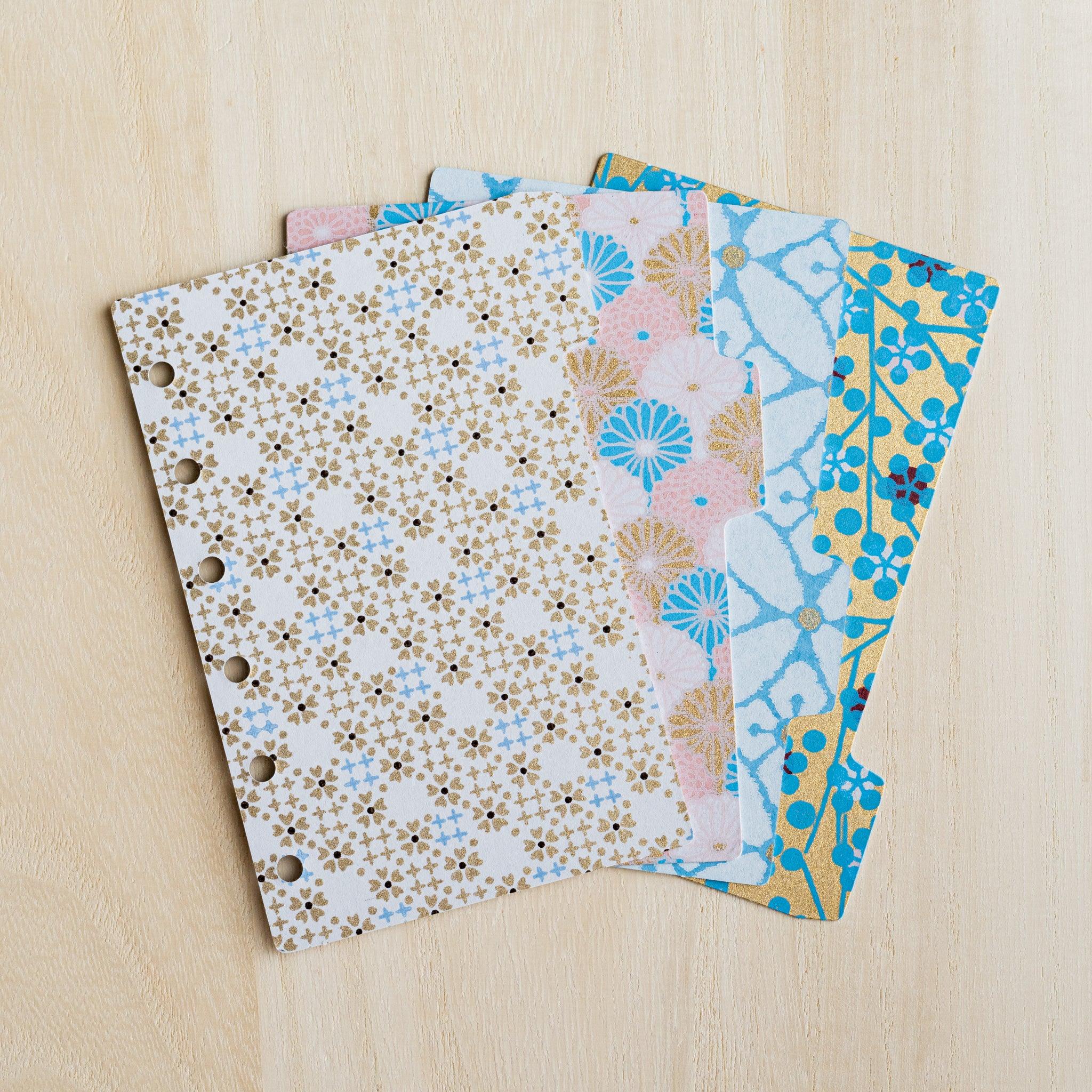 Four Tone Yuzen washi index dividers for Mini 6 planners fanned out, gold, pink and blue floral prints