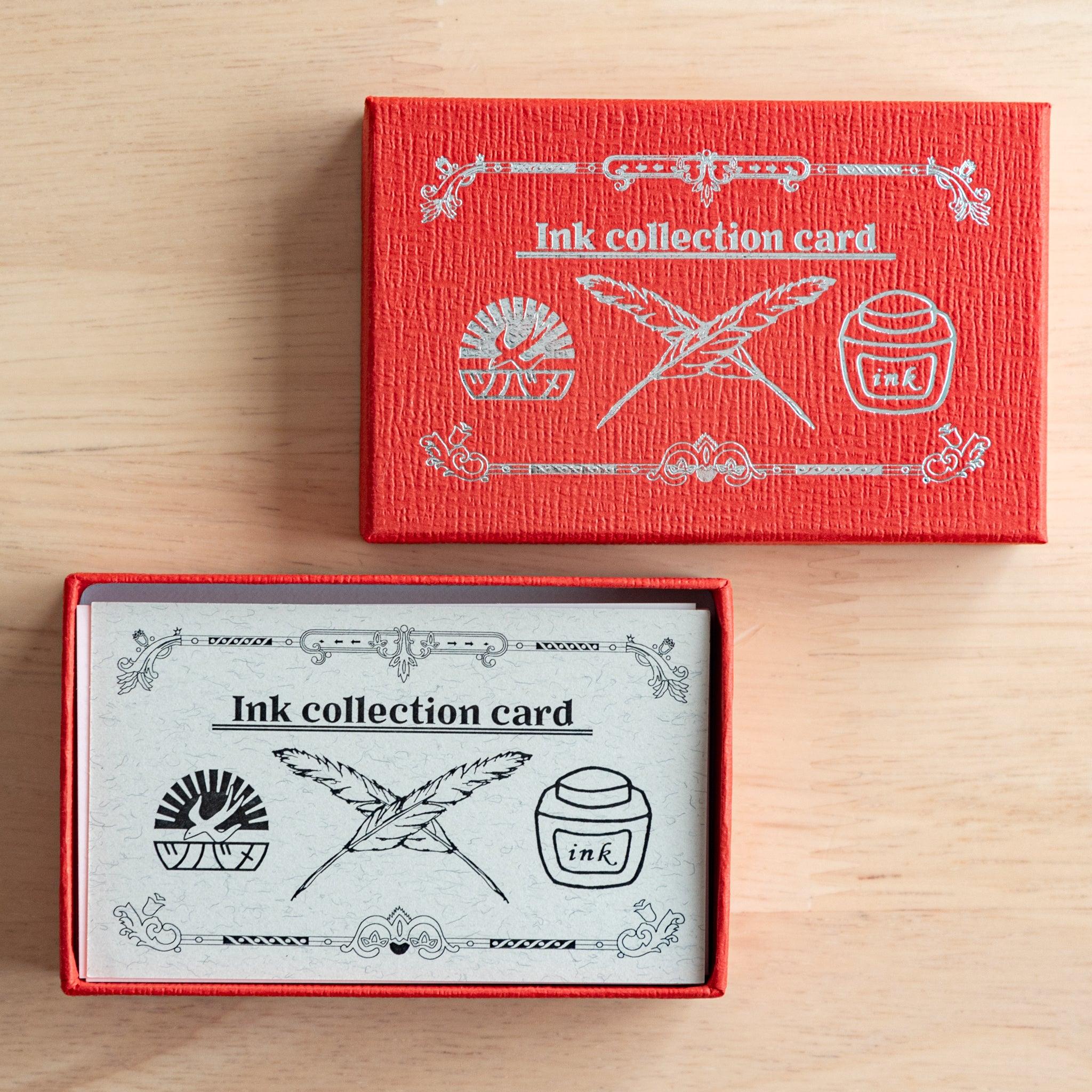 A red Tsubame Japanese stationery box labeled "Ink collection card," partially opened to reveal ink-themed cards with an ornate black and white design.  