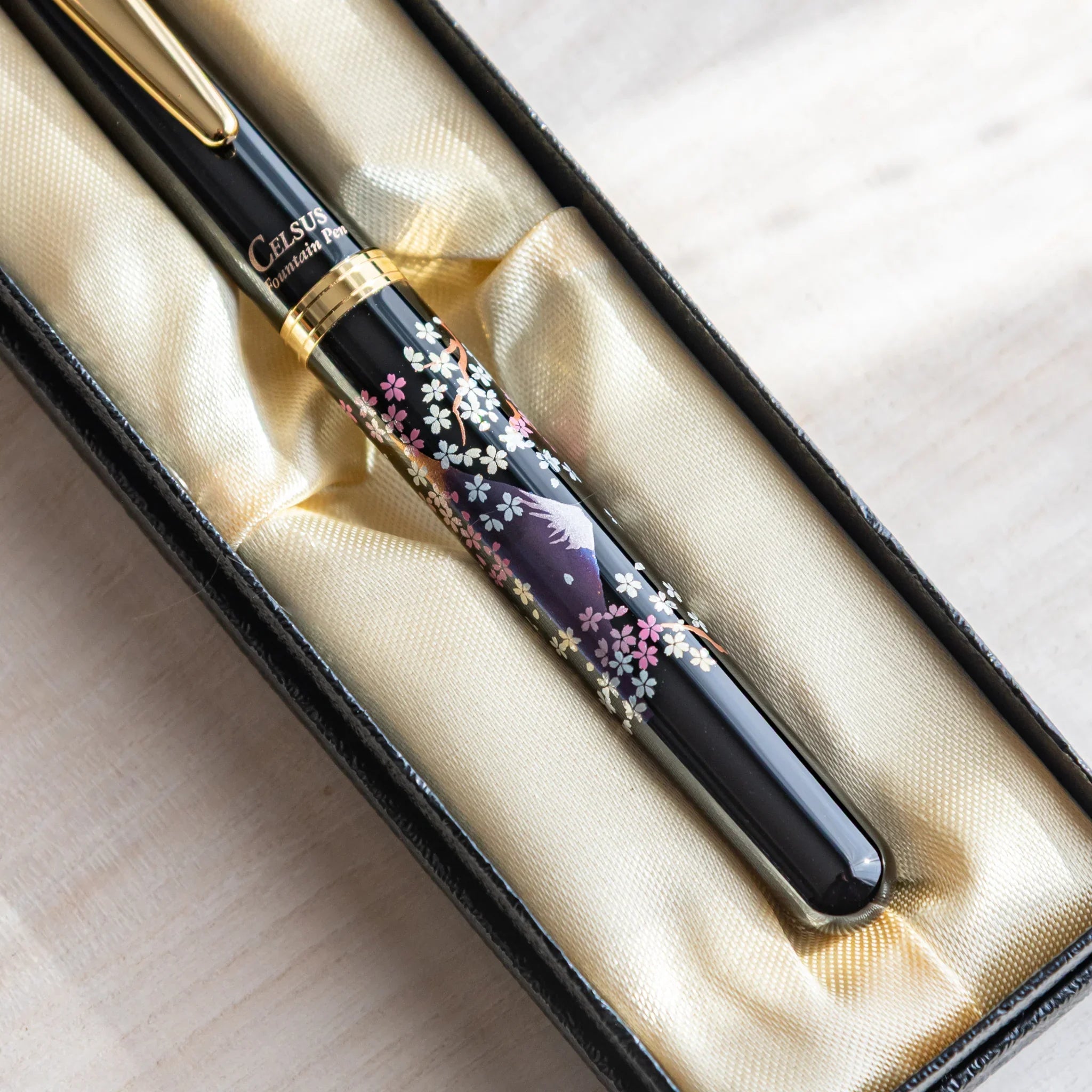 Japanese fountain pen with twilight Fuji and pink sakura design displayed in a gift box.