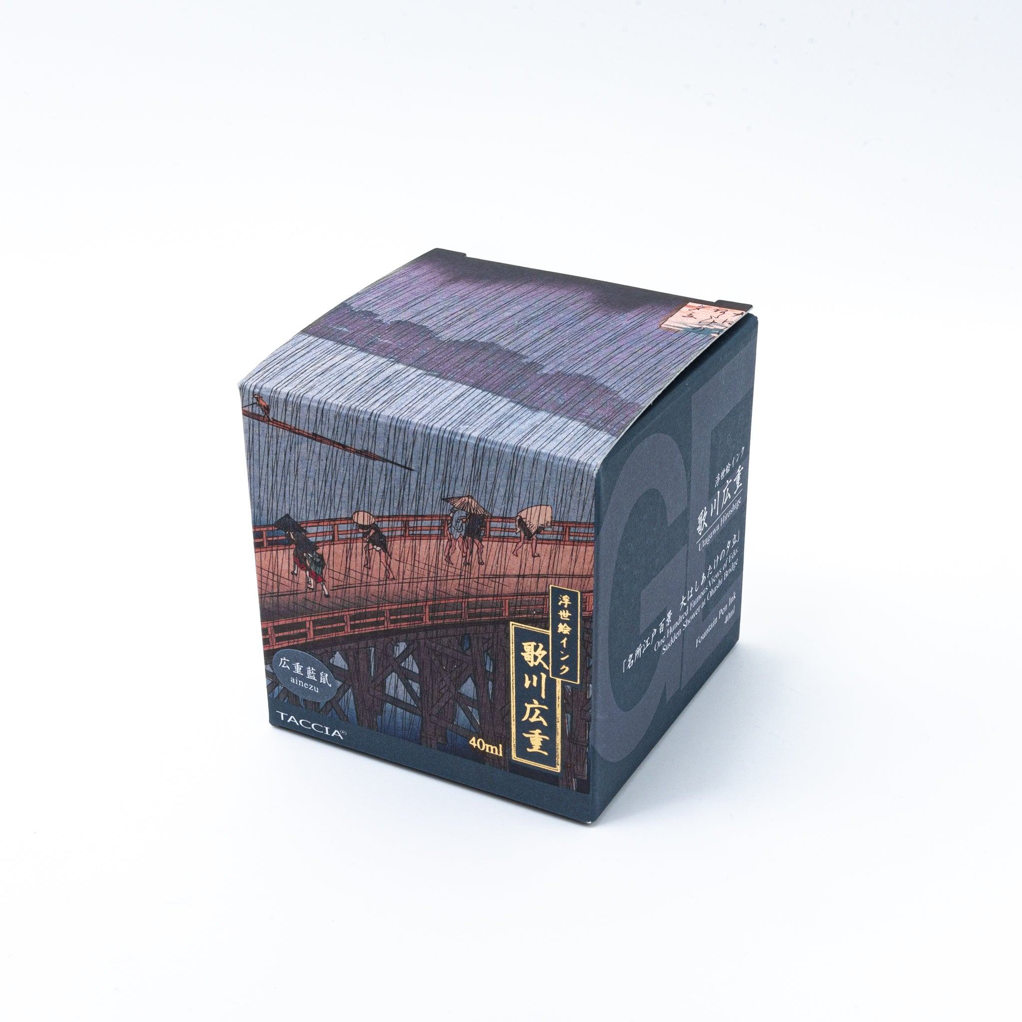 Japanese stationery fountain pen ink packaging. The box features Ukiyo-e style art of a rainy bridge scene. It contains 40ml of blue-gray "Ainezu" ink.  