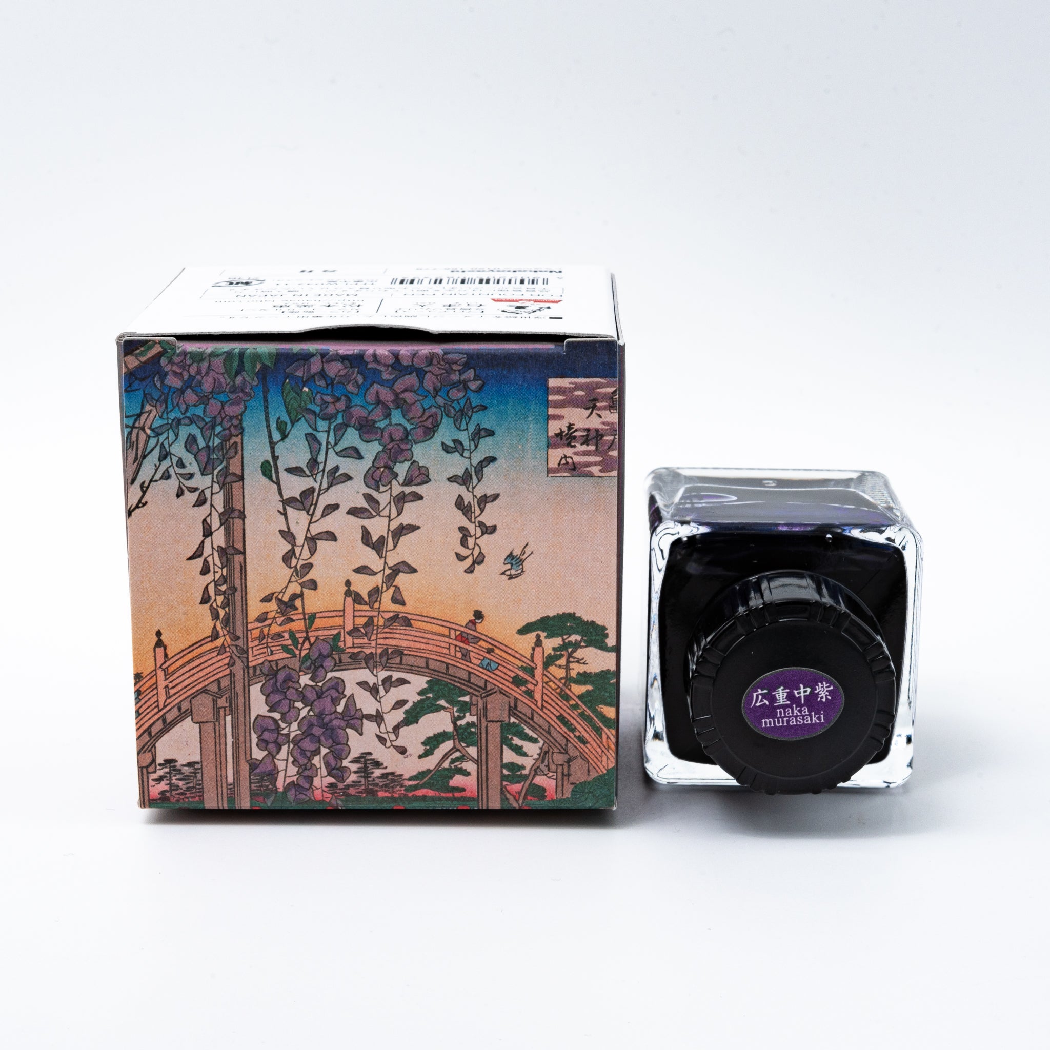 Japanese stationery fountain pen ink. The packaging features Ukiyo-e style art of a riverside scene with wisteria flowers. The glass bottle contains 40ml of purple "Maki Murasaki" ink.  