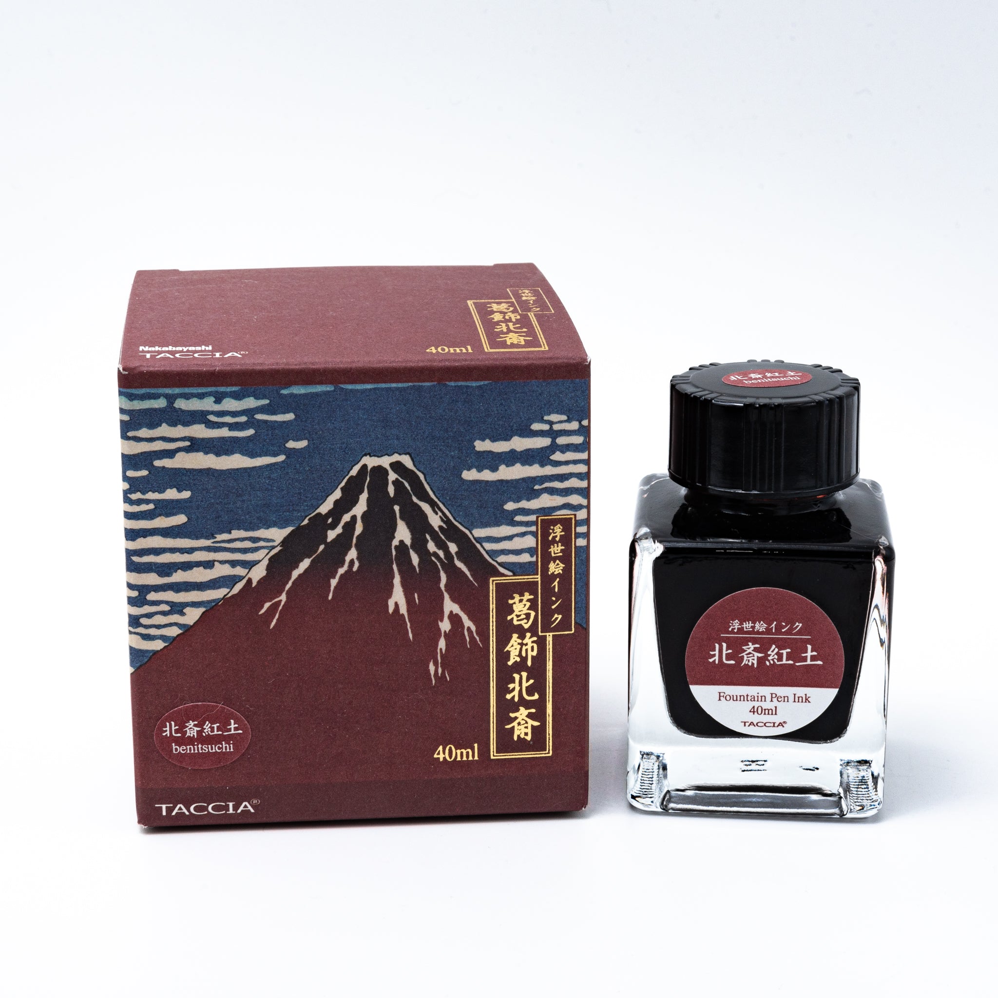 Japanese stationery fountain pen ink. The packaging features Ukiyo-e style art of Mount Fuji with a reddish-brown sky. The glass bottle contains 40ml of red "Benitsuchi" ink.  