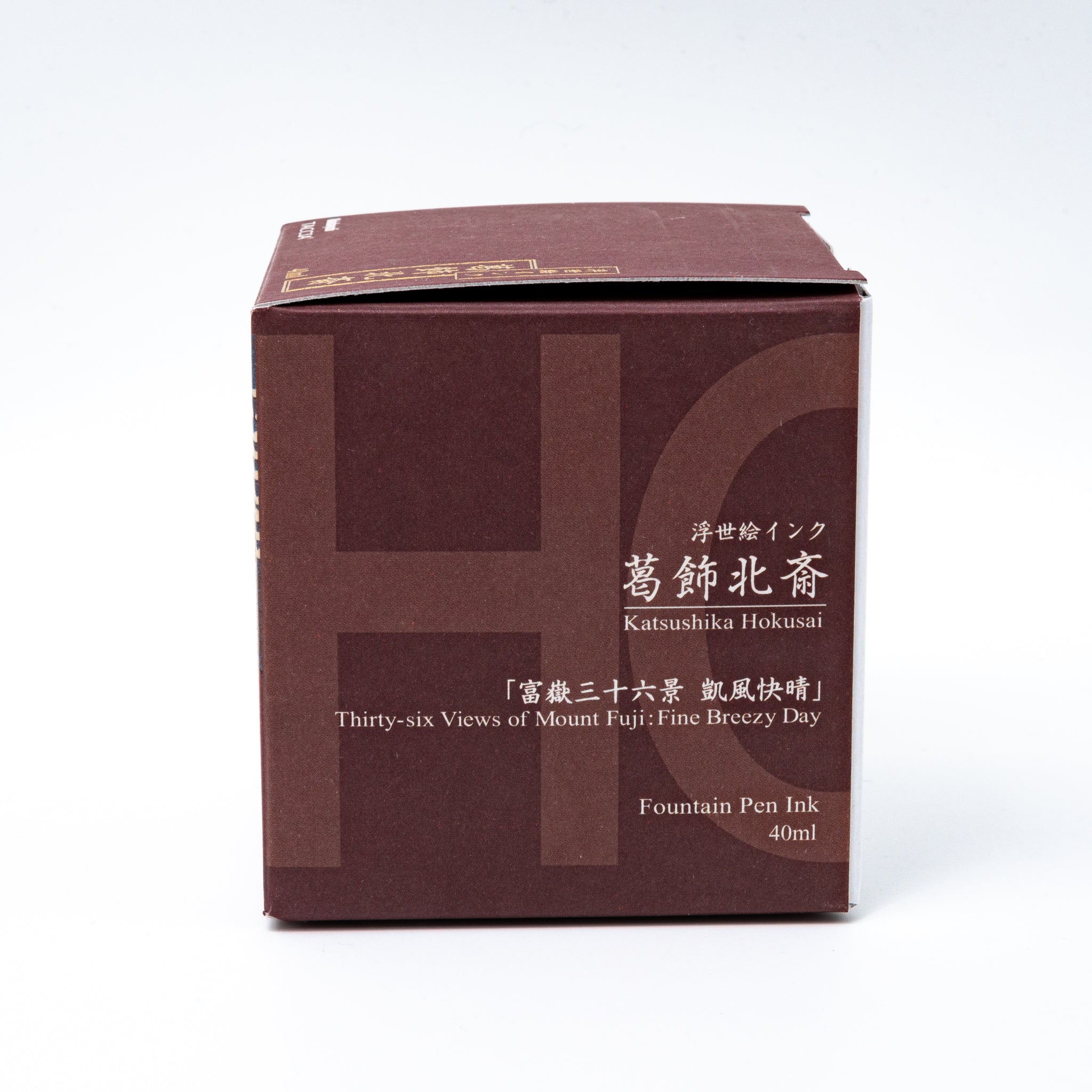 Japanese stationery fountain pen ink packaging. The box features Ukiyo-e style art of Mount Fuji with a reddish-brown sky. It contains 40ml of red "Benitsuchi" ink.  