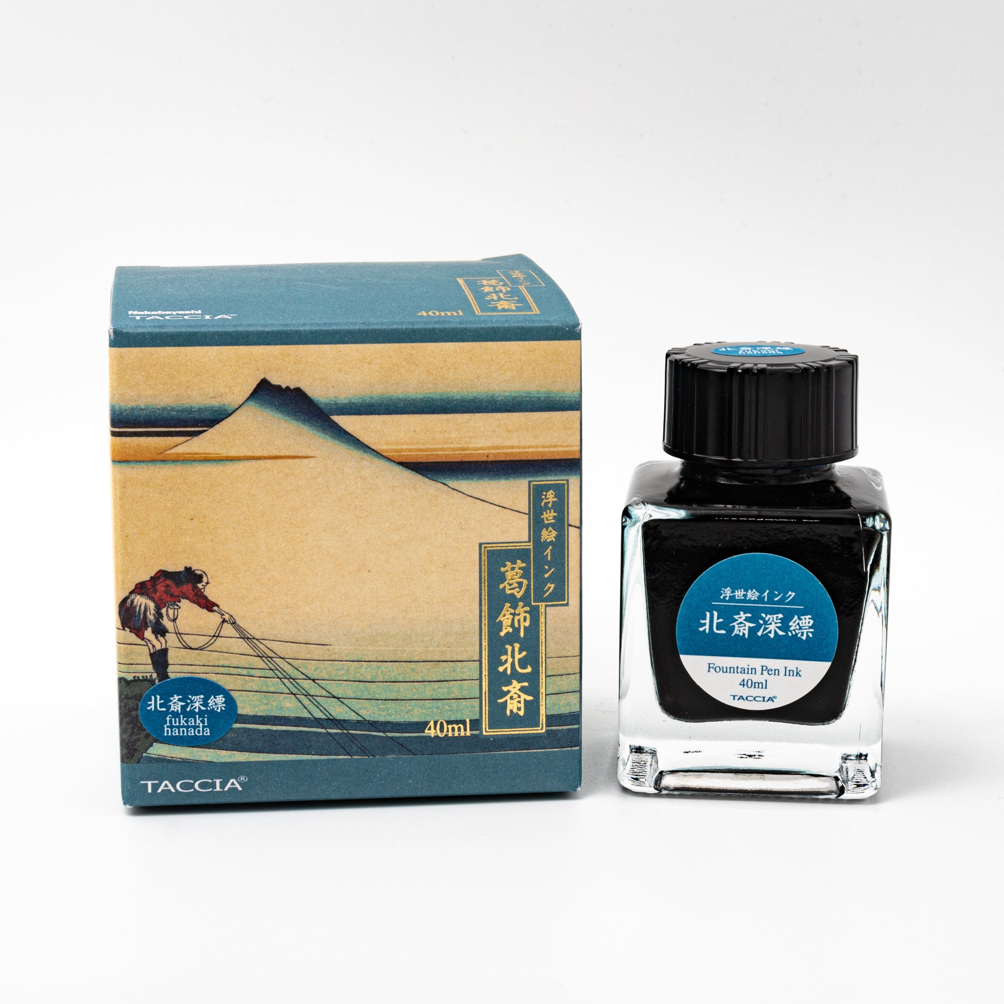 Japanese stationery fountain pen ink. The packaging features Ukiyo-e style art of Mount Fuji with fishermen pulling nets. The glass bottle contains 40ml of deep blue "Fukaki Hanada" ink.  