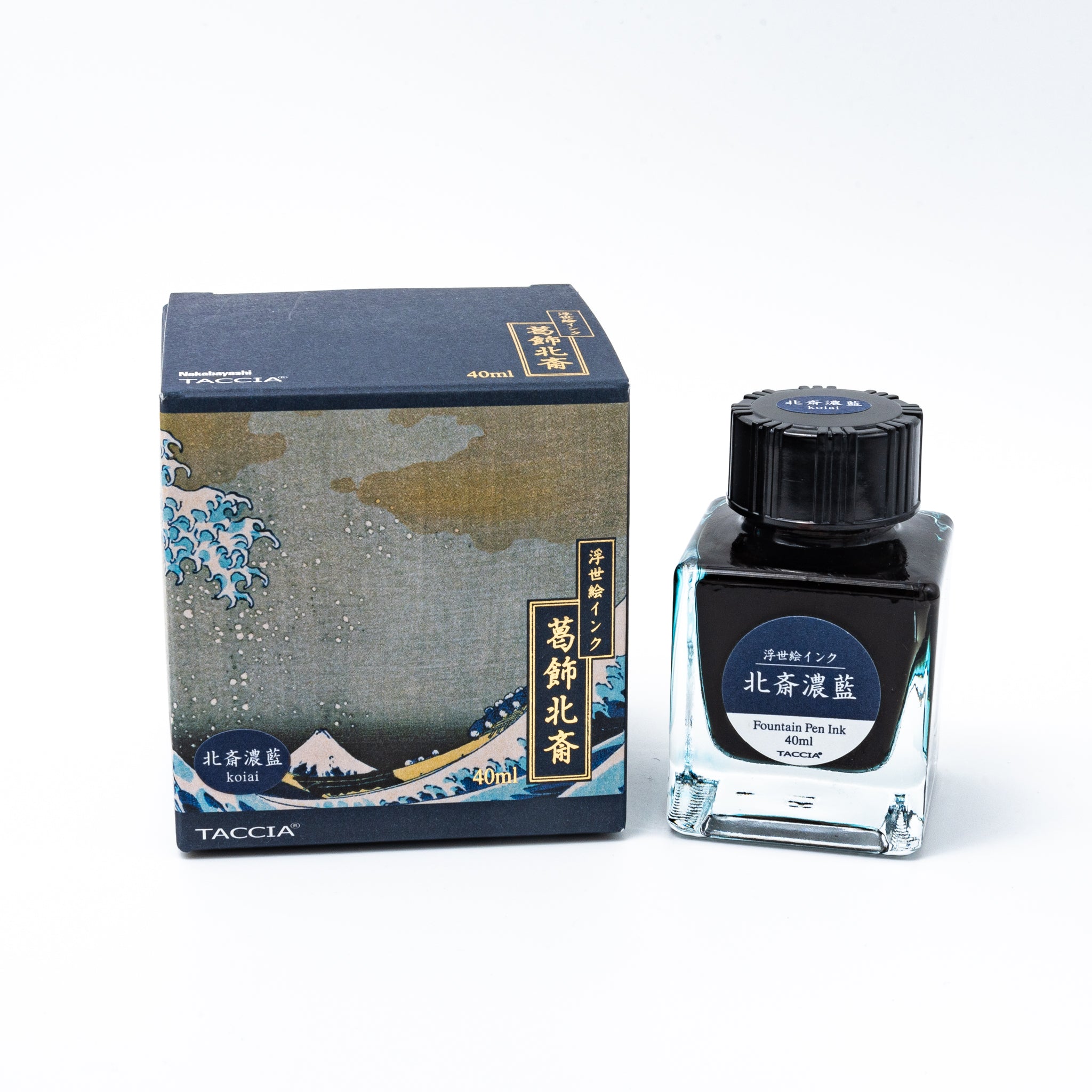 Japanese stationery fountain pen ink. The packaging features Ukiyo-e art of a great wave with Mount Fuji. The glass bottle contains 40ml of deep blue "Koiai" ink.  