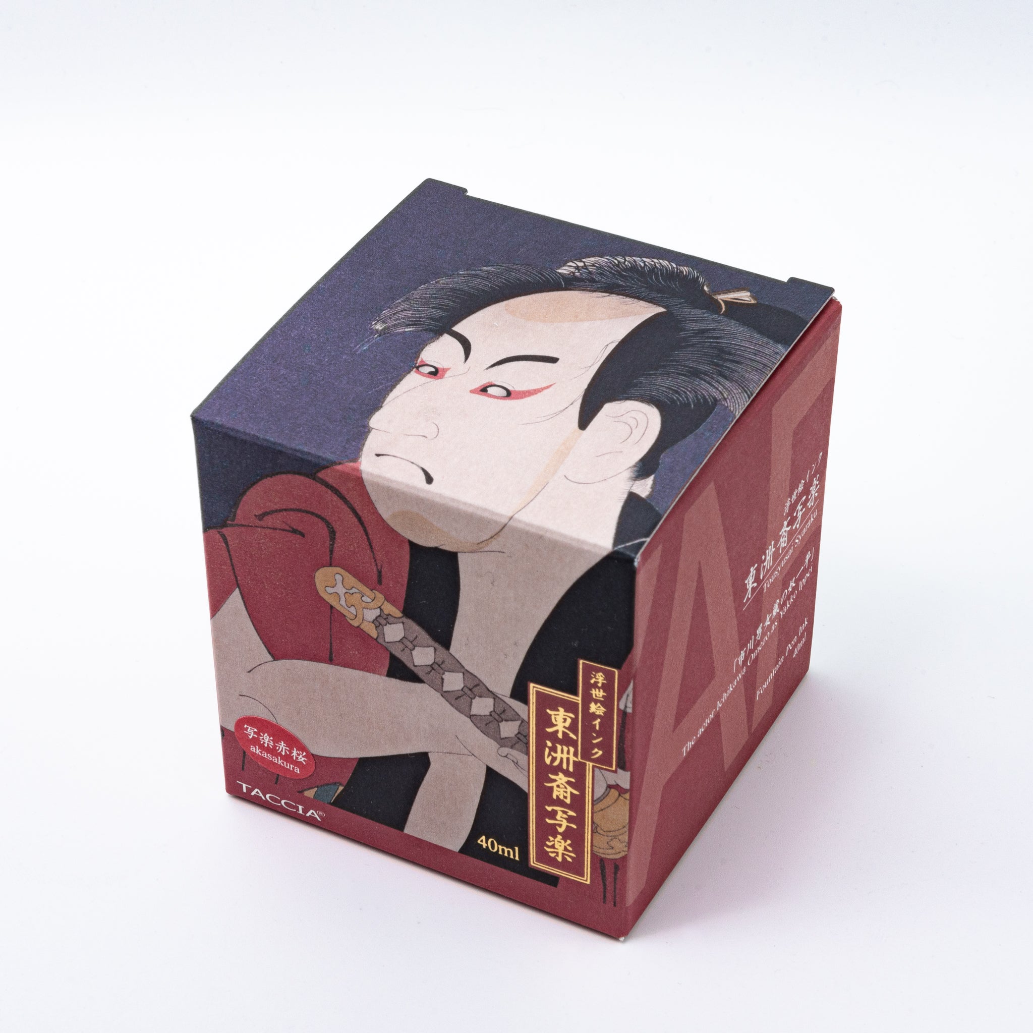 Japanese stationery fountain pen ink packaging. The box features Ukiyo-e style art of a kabuki actor in a red kimono. It contains 40ml of reddish-brown "Akasakura" ink.  