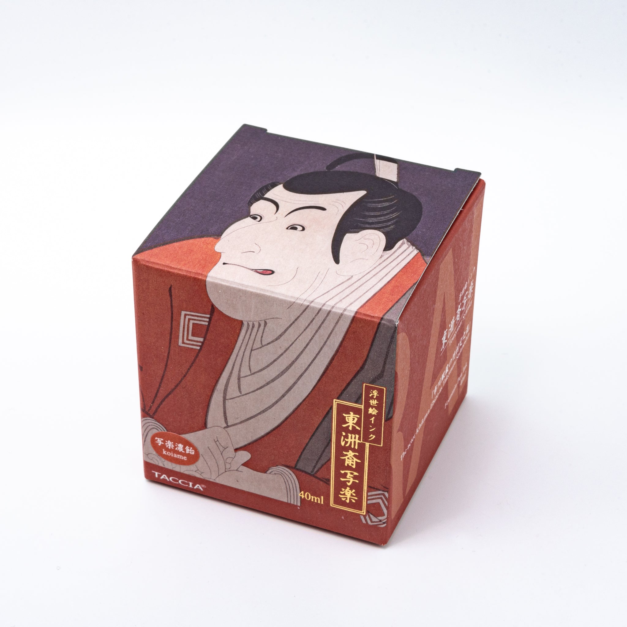 Japanese stationery fountain pen ink packaging. The box features Ukiyo-e style art of a kabuki actor in a red kimono. It contains 40ml of brown "Koiame" ink.  