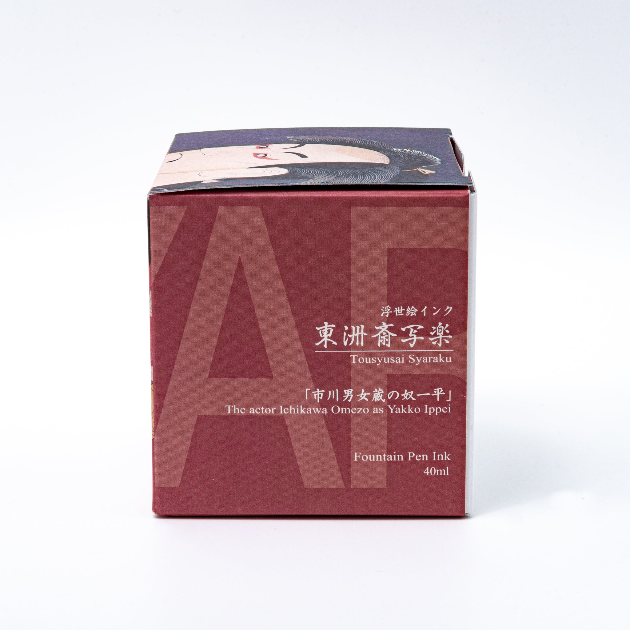 Japanese stationery fountain pen ink packaging. The box features Ukiyo-e style art of a kabuki actor in a red kimono. It contains 40ml of brown "Koiame" ink.  