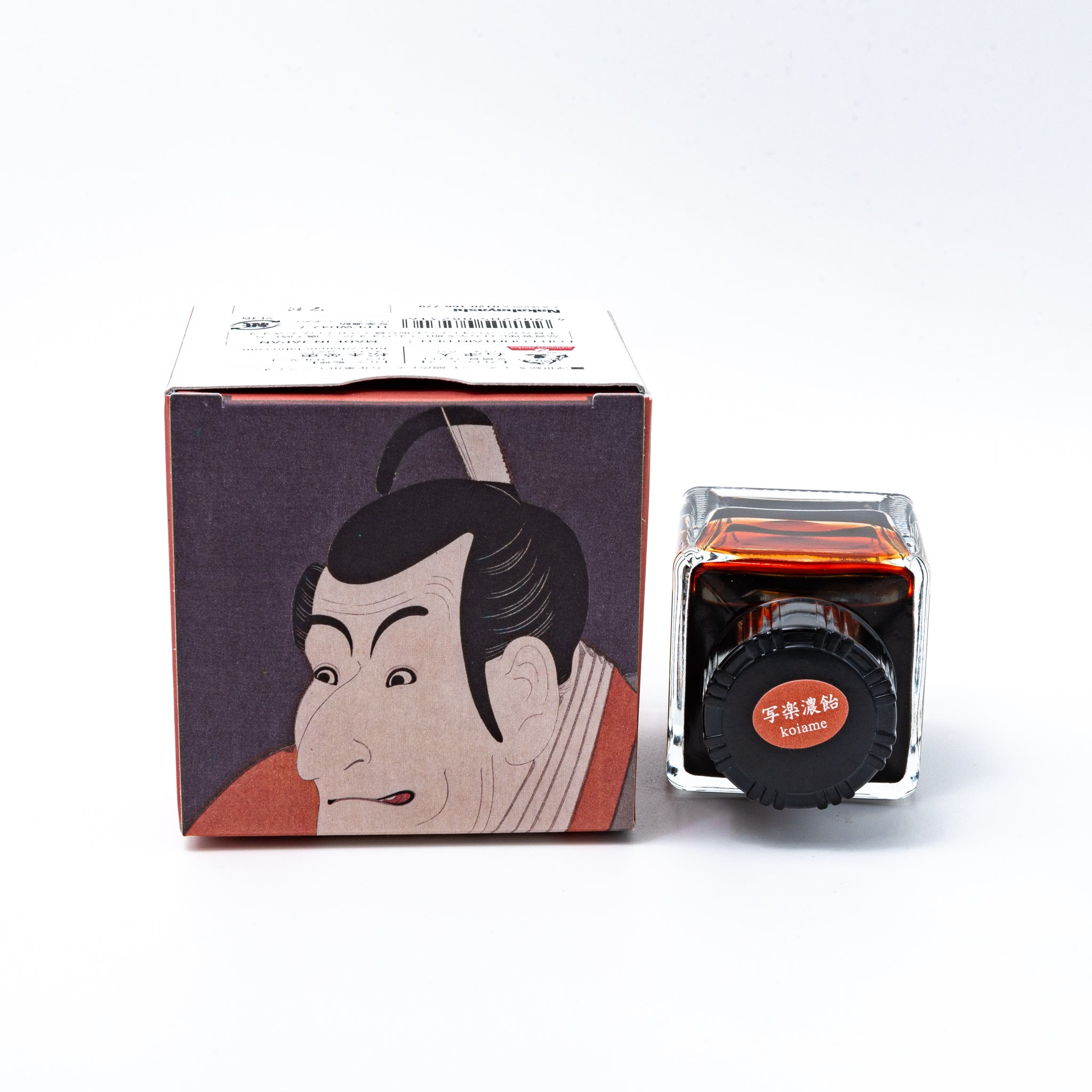 Japanese stationery fountain pen ink. The packaging features Ukiyo-e style art of a kabuki actor in a red kimono. The glass bottle contains 40ml of brown "Koiame" ink.  