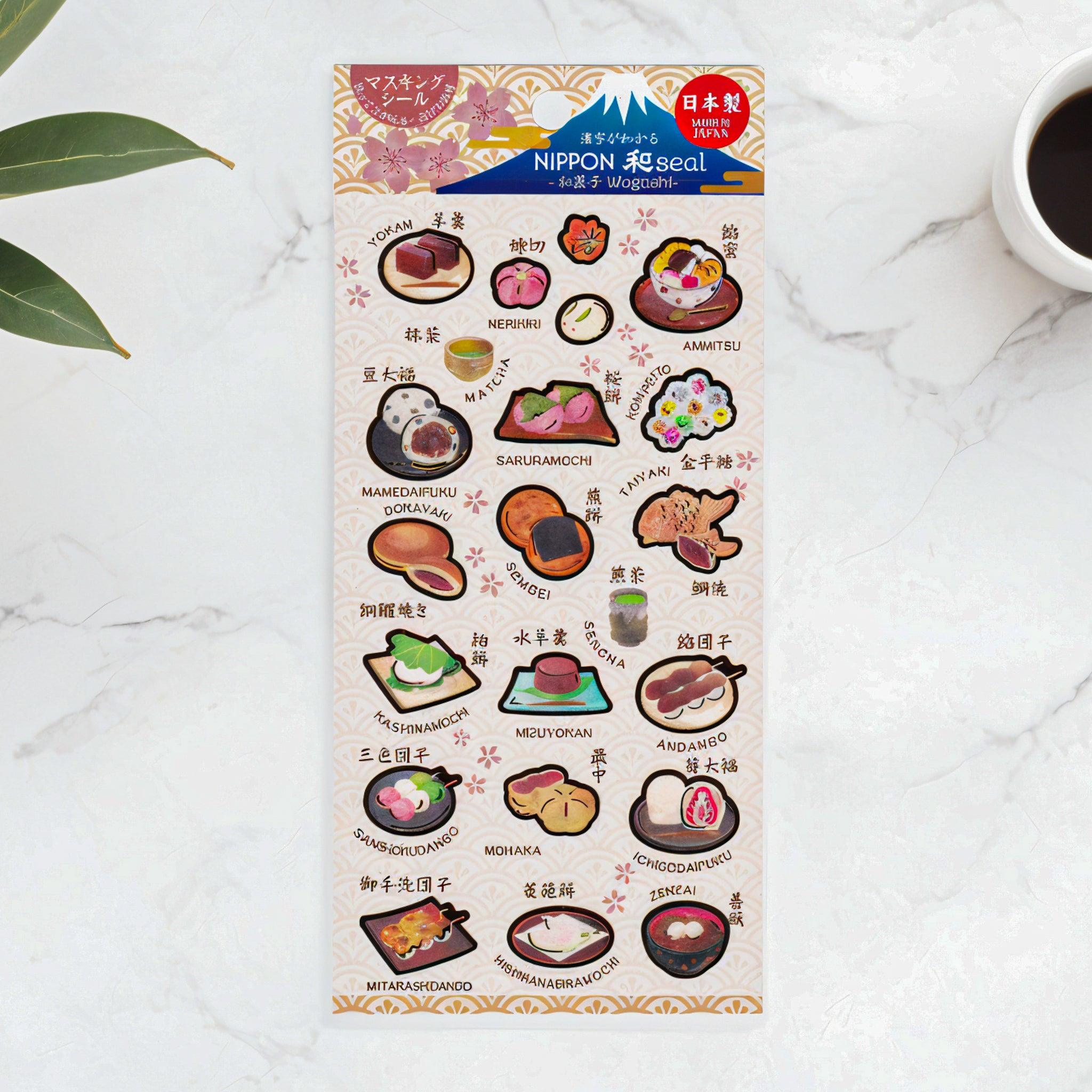 A Japanese stationery washi sticker sheet featuring traditional Japanese sweets, including taiyaki, dorayaki, yokan, dango, and matcha, with delightful illustrations.