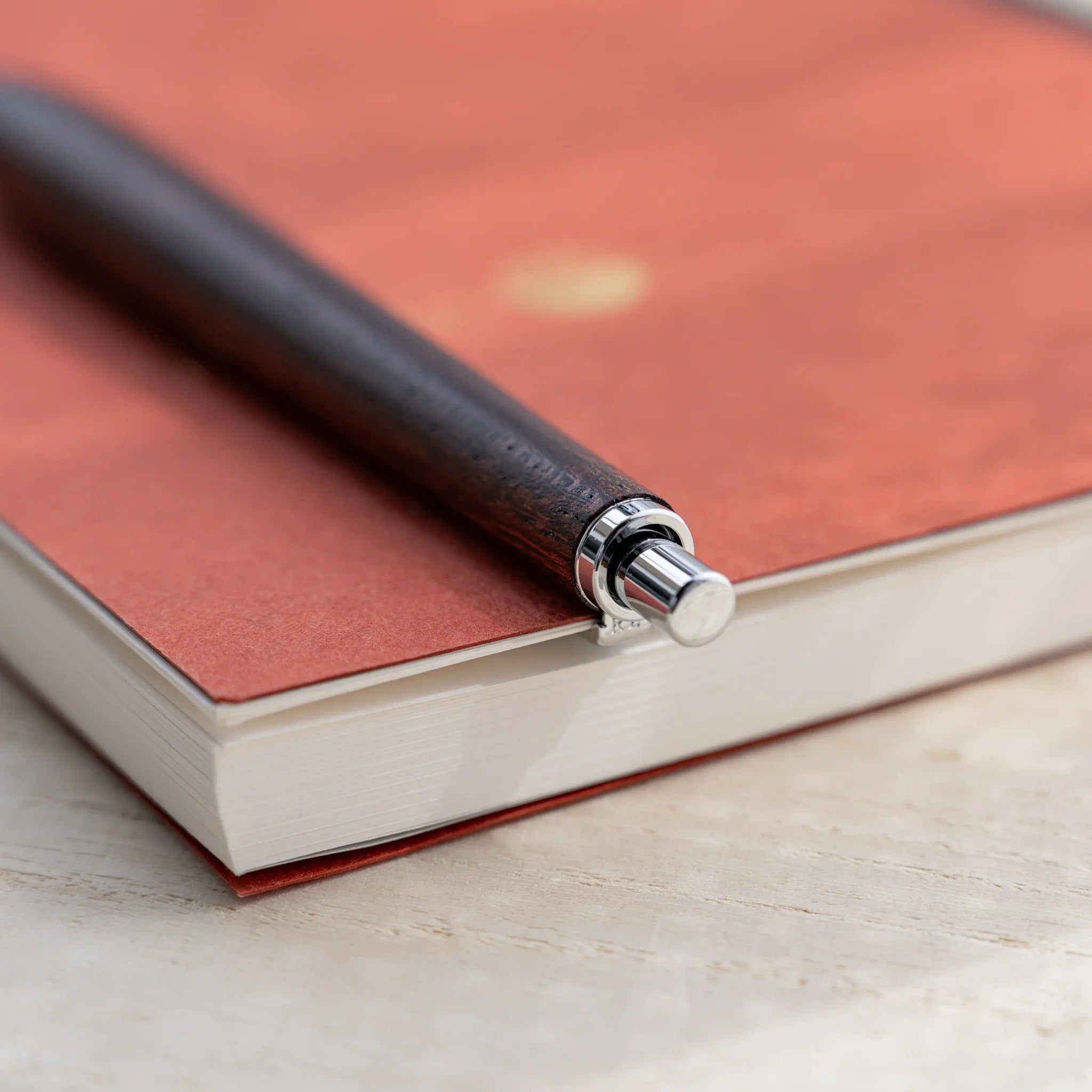 Zelkova wood urushi lacquered mechanical pencil in dark reddish-brown, Japanese keyaki wood, angled full-body view