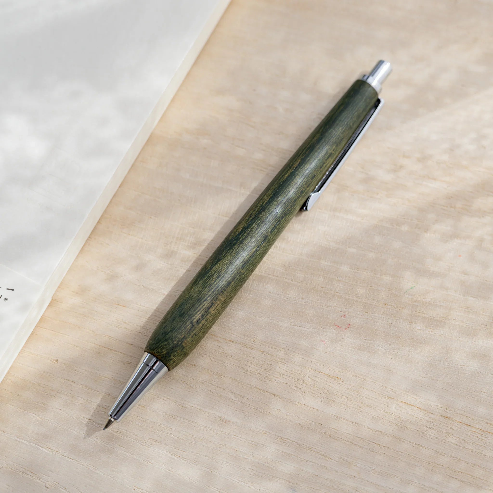 Zelkova wood urushi lacquered mechanical pencil in olive green, Japanese keyaki wood, silver knock and clip