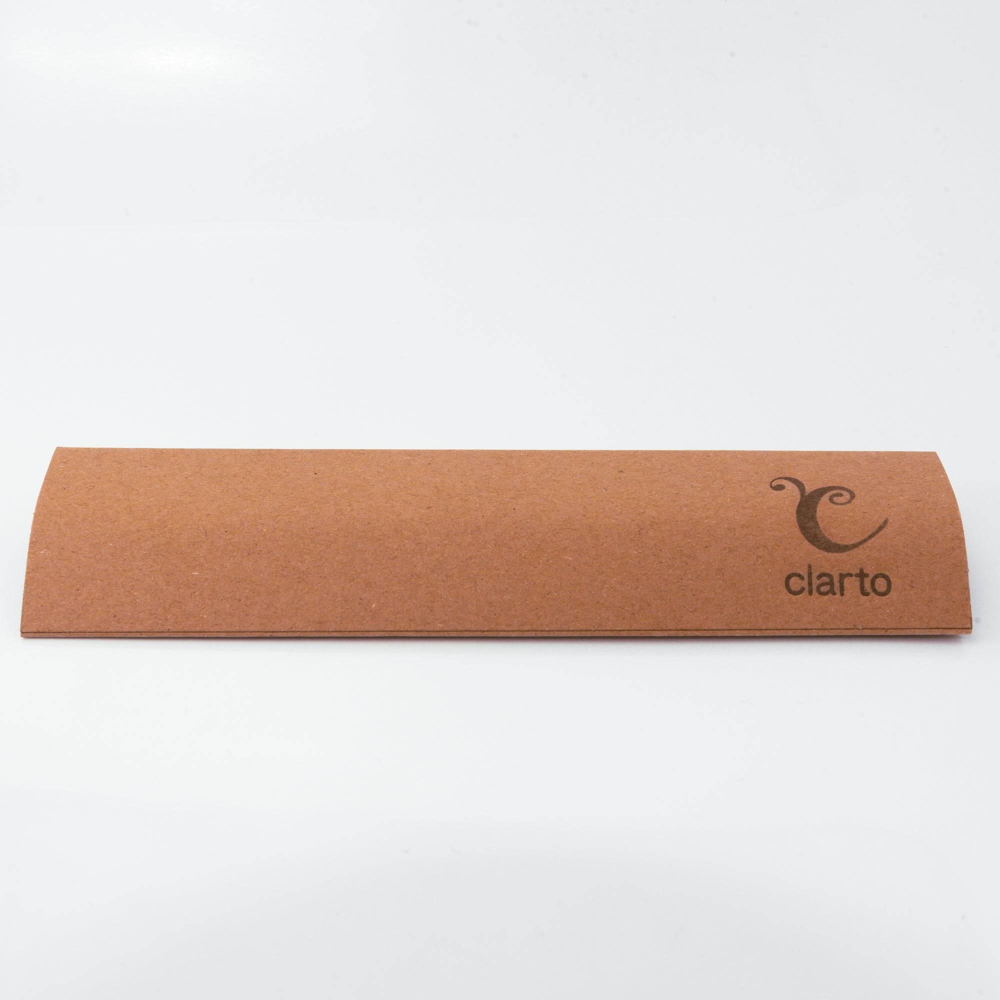 Eco-friendly ruler-style brown packaging with Clarto logo, designed to protect and store the glass pen securely.