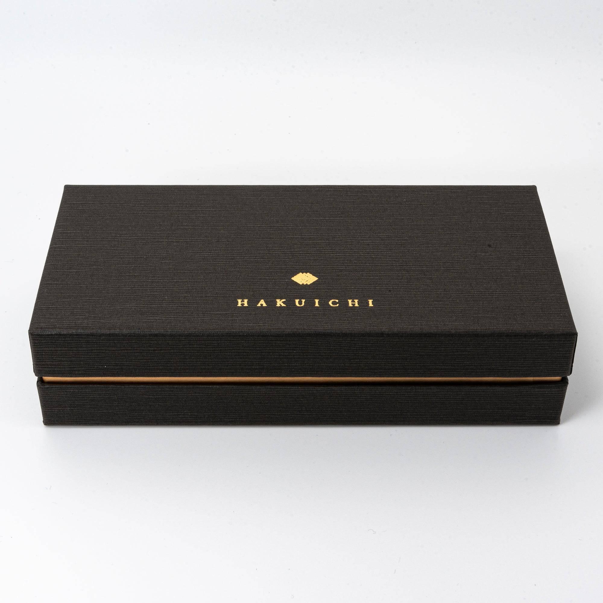 Rectangular black gift box with "HAKUICHI" logo in gold, featuring a textured surface and minimalist design.