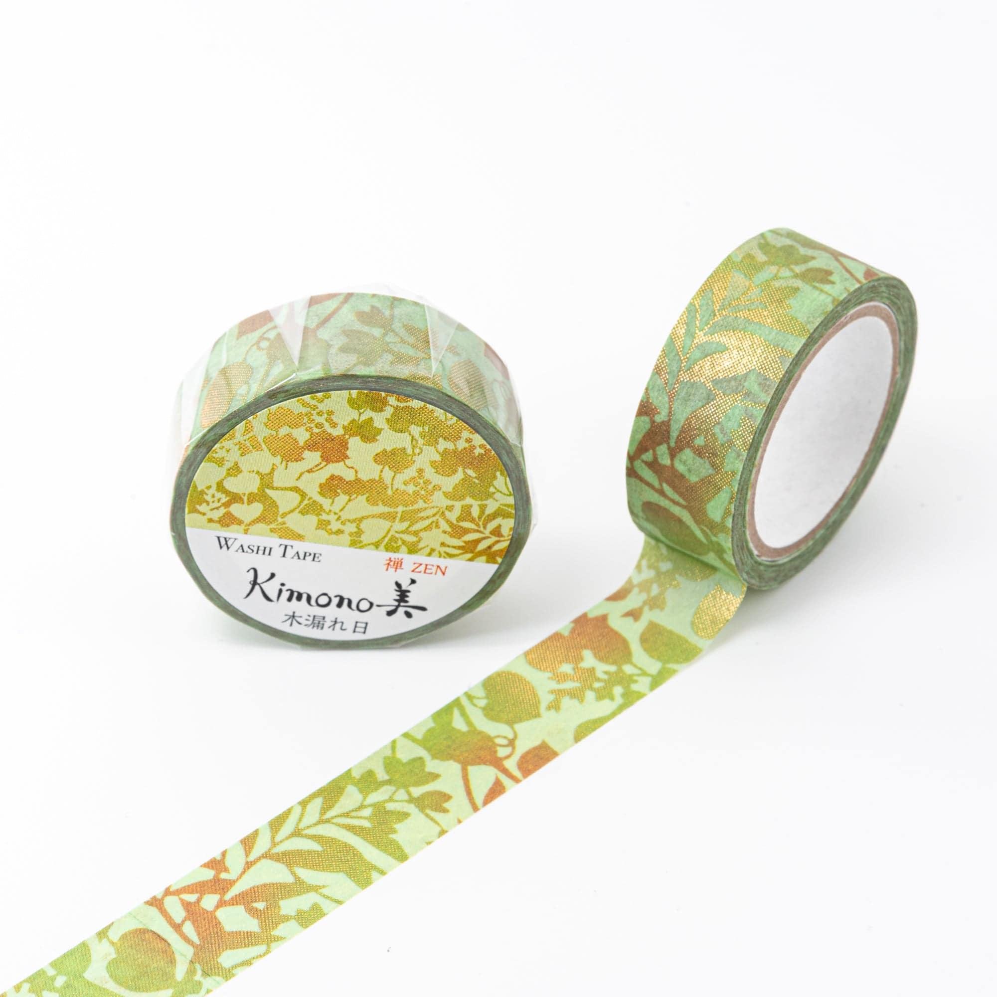 Roll of Iyo Washi Tape with Komorebi patterns, unraveling to reveal its artistic motifs, placed on a wooden surface under natural light.  