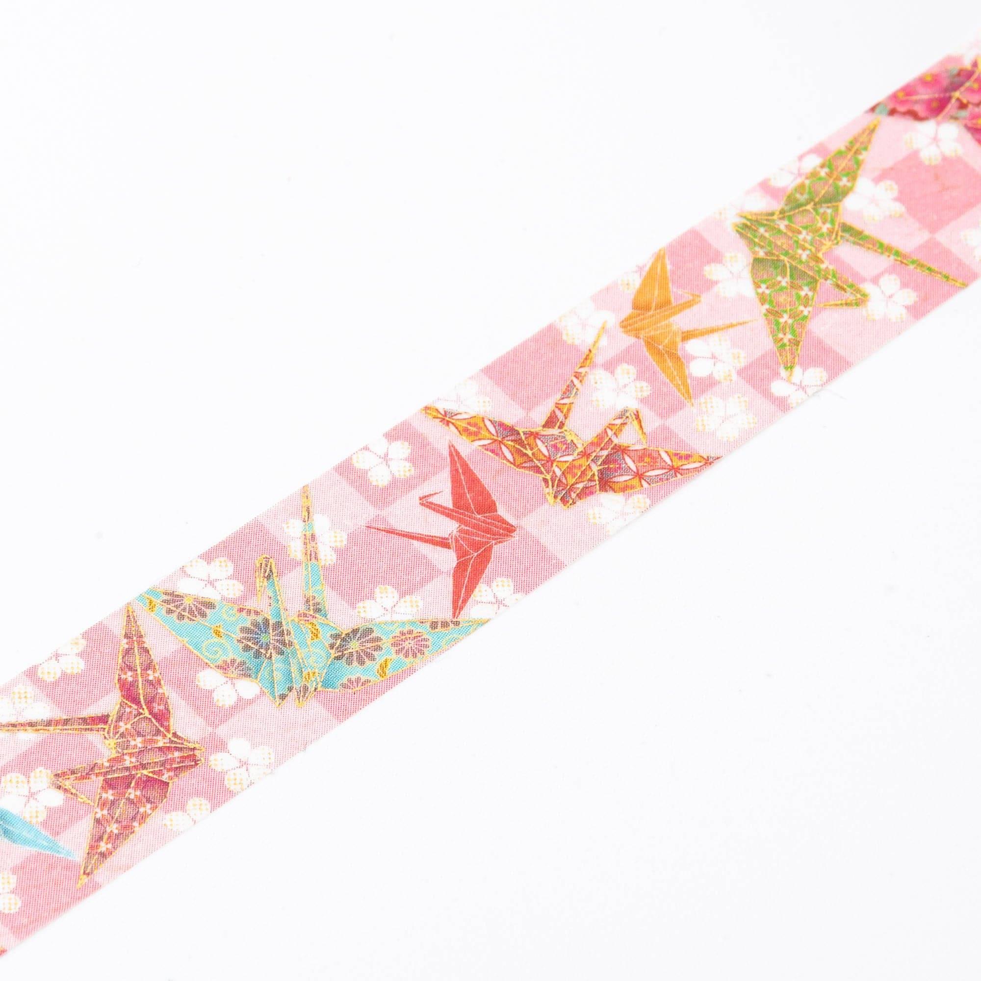 Close-up of Iyo Washi Tape showcasing delicate origami crane patterns, highlighting vibrant colors and intricate designs.  