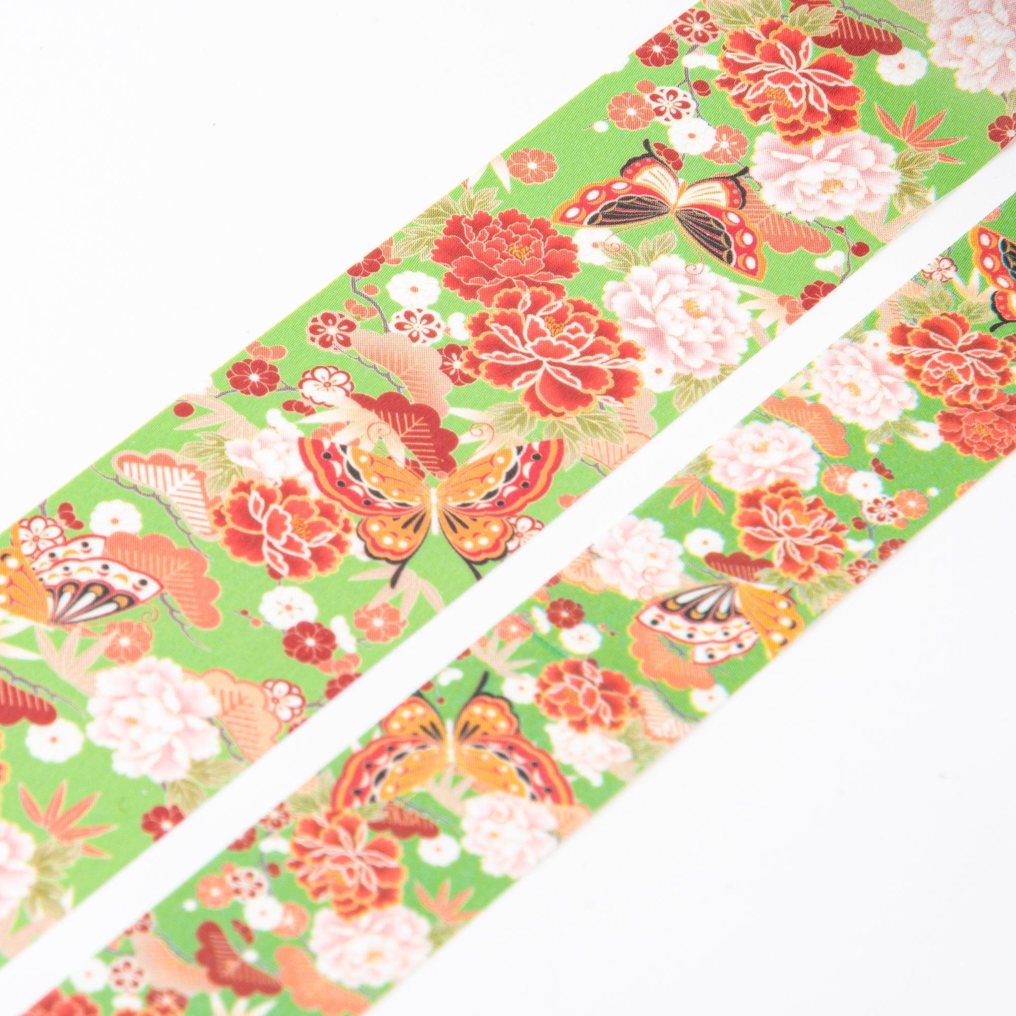 Close-up of Iyo Washi Tape with pine, bamboo, and plum motifs, showcasing vibrant butterfly details and traditional Japanese aesthetics.  