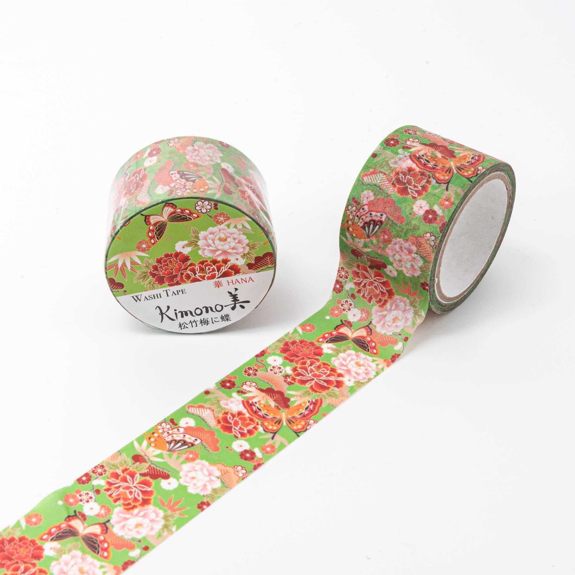 Iyo Washi Tape featuring intricate butterfly and floral patterns, elegantly displayed on a wooden surface under soft lighting.  