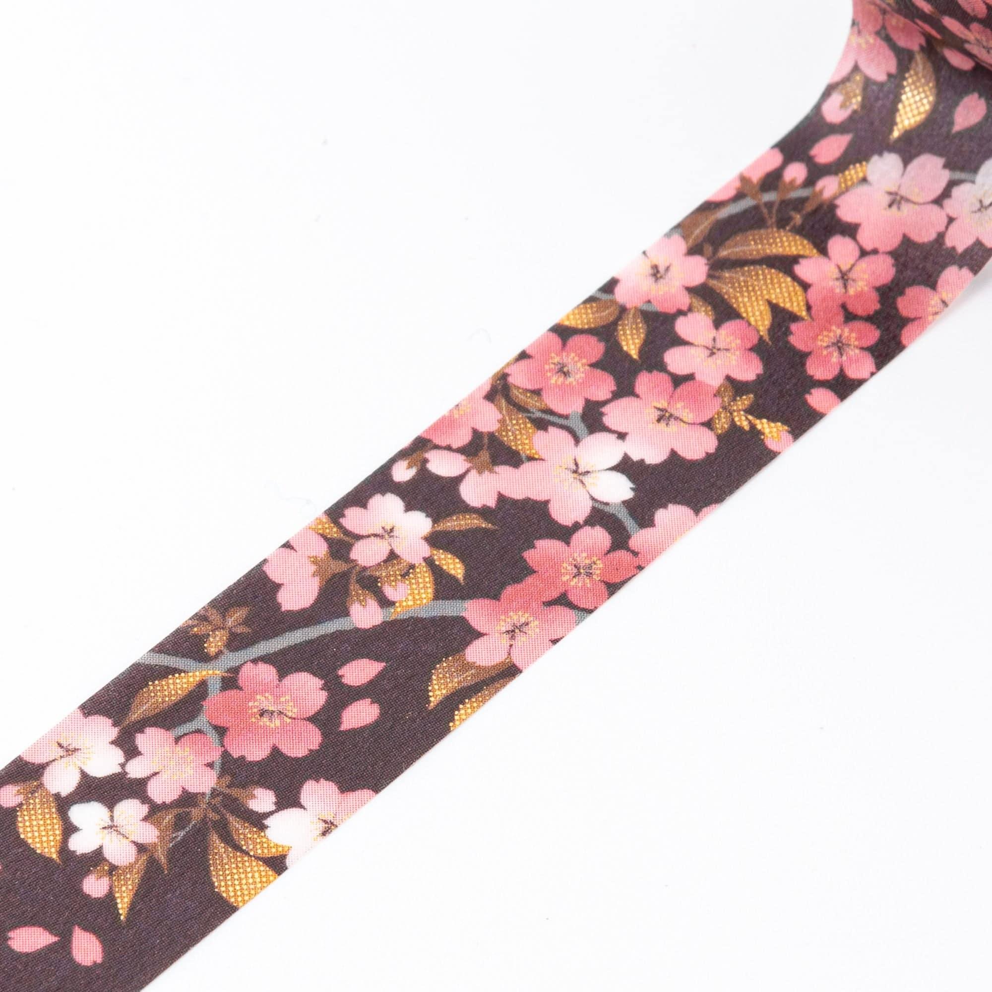 Close-up of Iyo Washi Tape showcasing delicate sakura patterns, emphasizing vibrant floral designs and artistic details.  