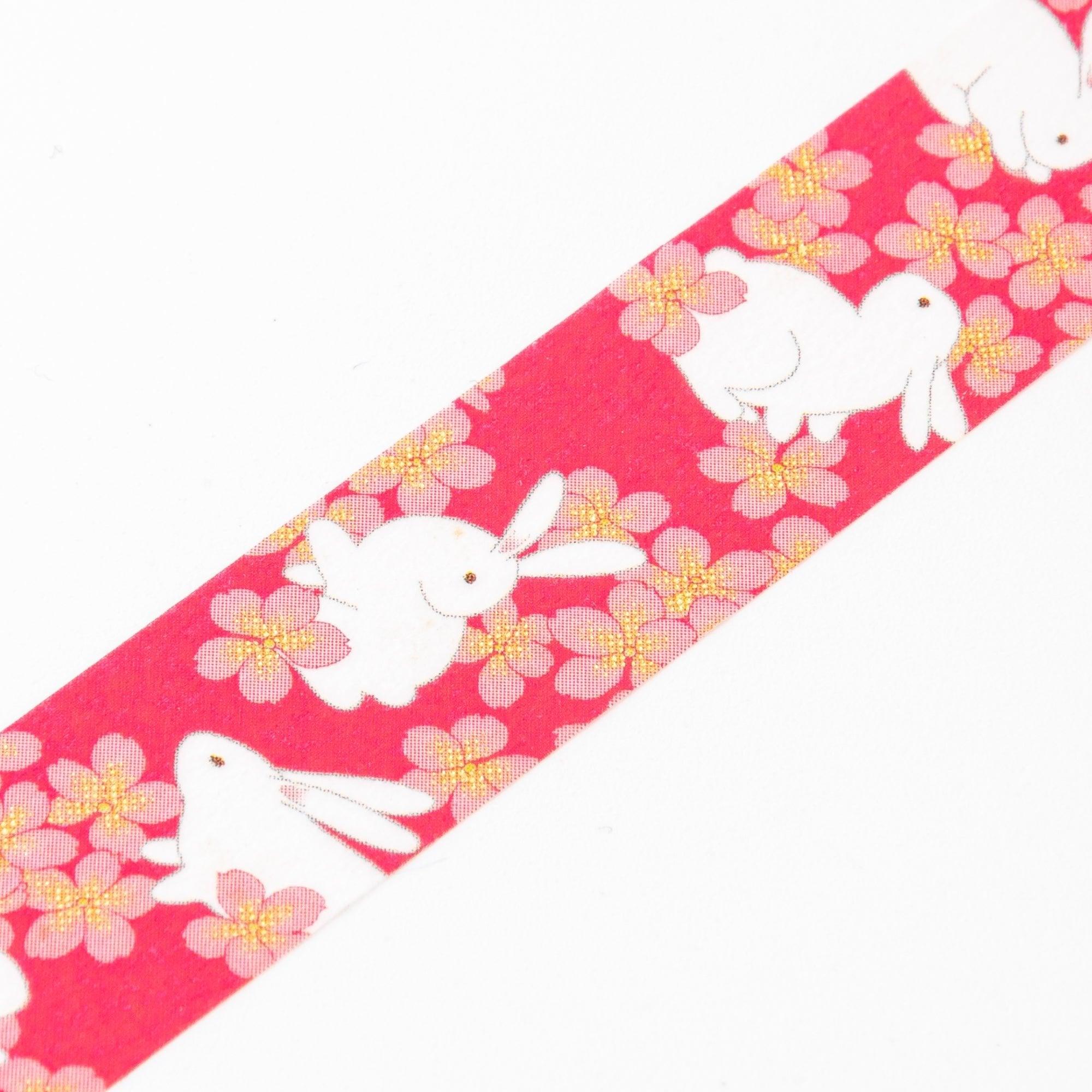 Close-up of Iyo Washi Tape showcasing intricate sakura rabbits patterns, highlighting vibrant colors and artistic details.  