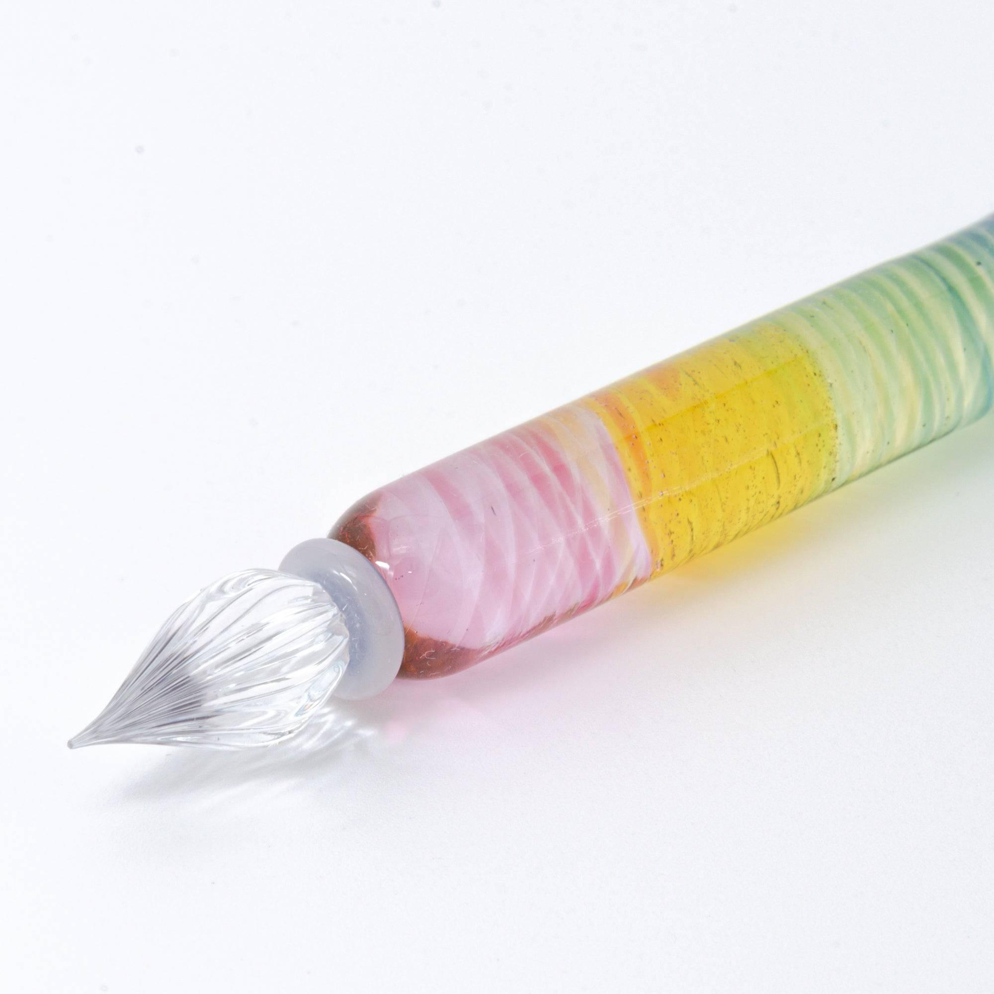 Short glass dip pen with vibrant rainbow colors and a spiral design, perfect for Japanese stationery enthusiasts, displayed on a clean white background.