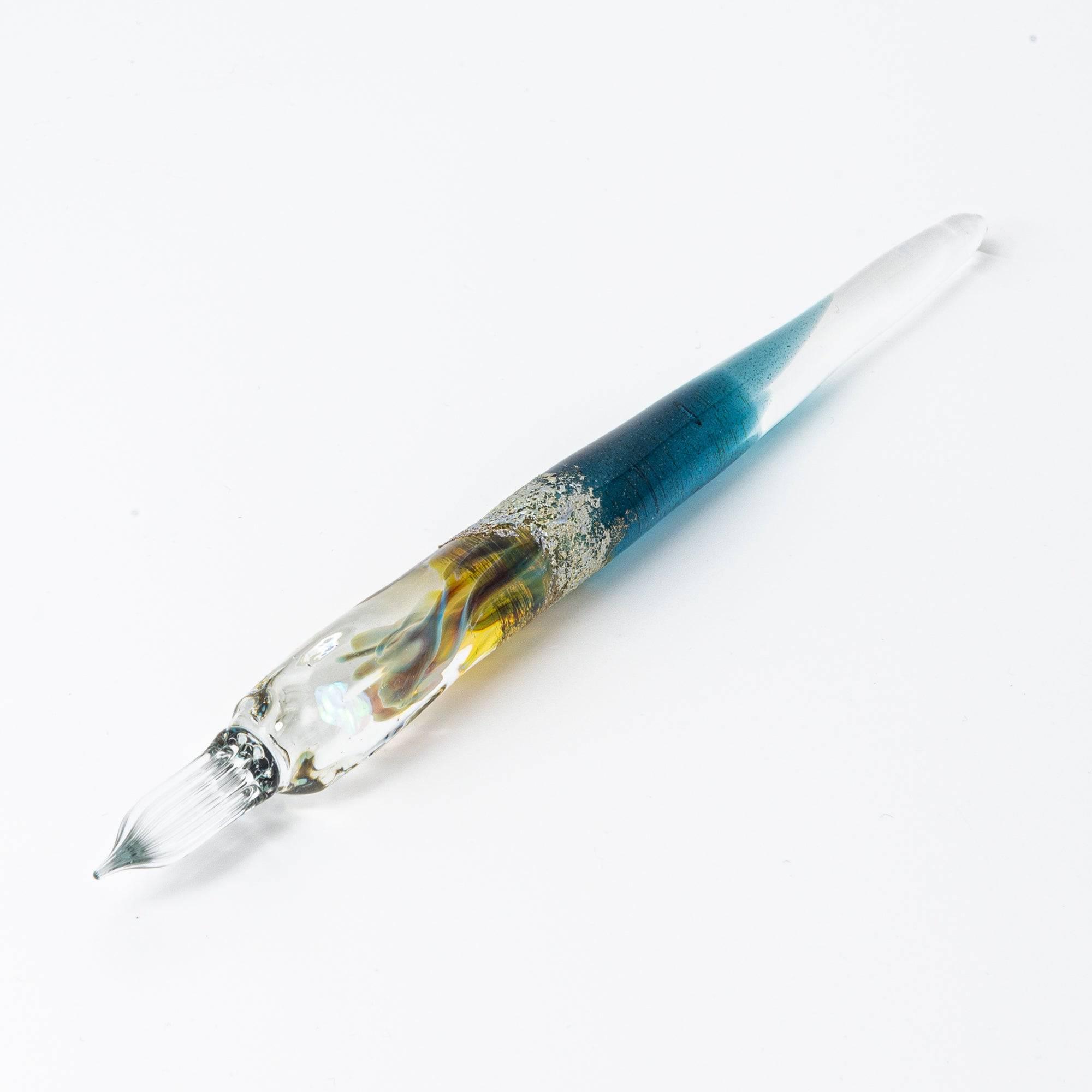 Elegant glass pen with a suspended opal and silver accents, featuring a gradient from blue to clear. Perfect for luxury writing experiences.