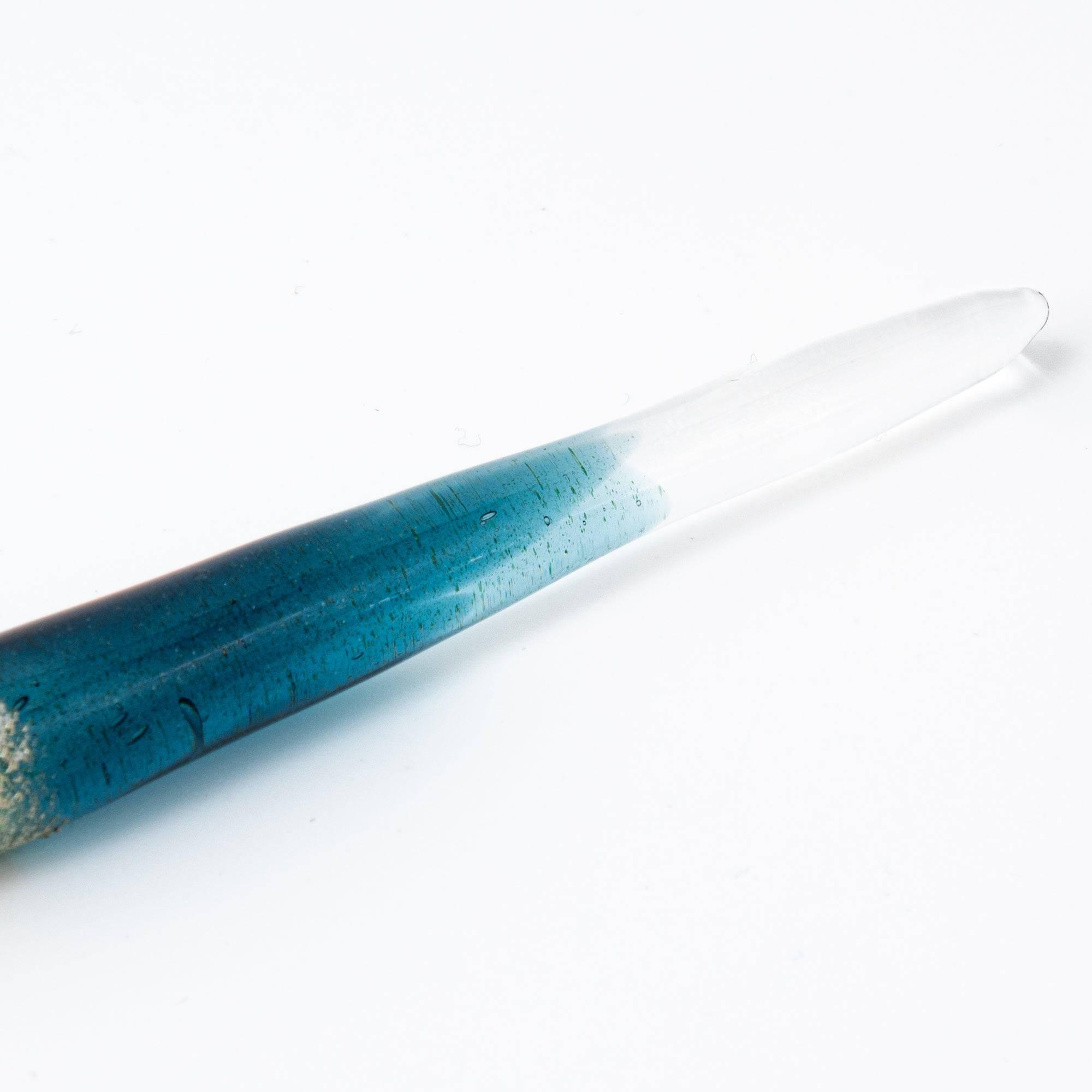 Elegant glass pen with a suspended opal and silver accents, featuring a gradient from blue to clear. Perfect for luxury writing experiences.