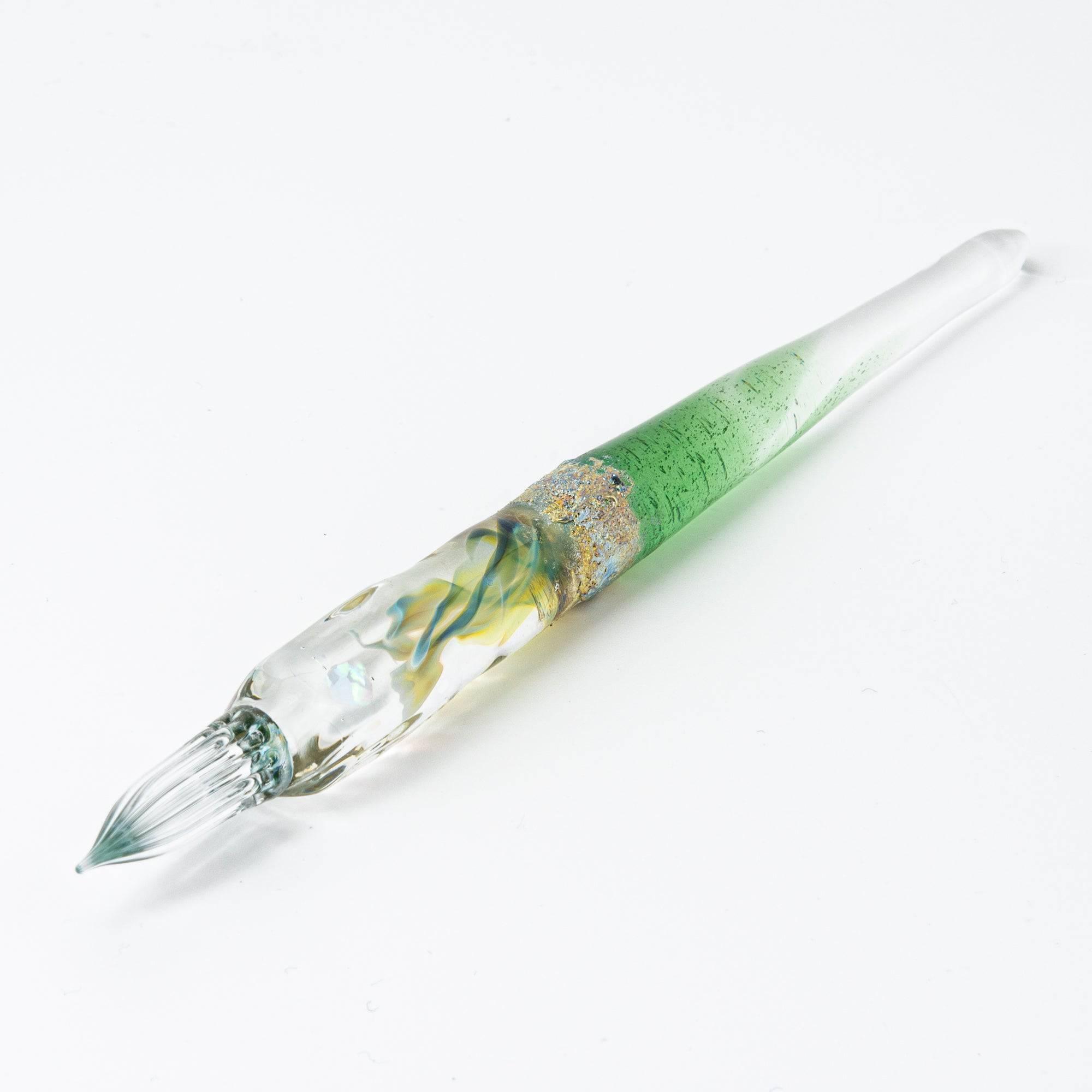 Glass pen with a light blue gradient and suspended opal, accented with silver. A luxurious writing instrument for those who appreciate elegance.