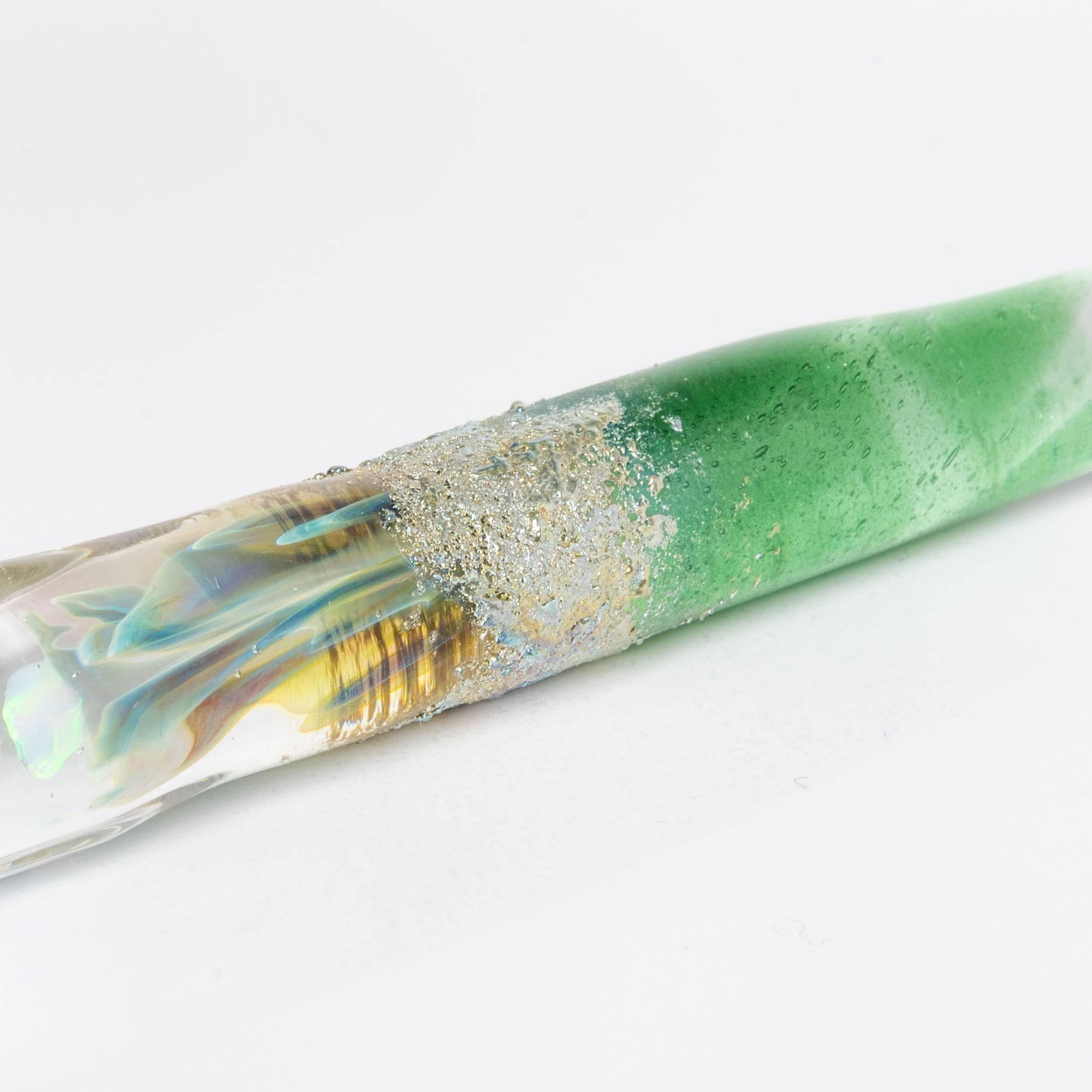 Glass pen with a light blue gradient and suspended opal, accented with silver. A luxurious writing instrument for those who appreciate elegance.